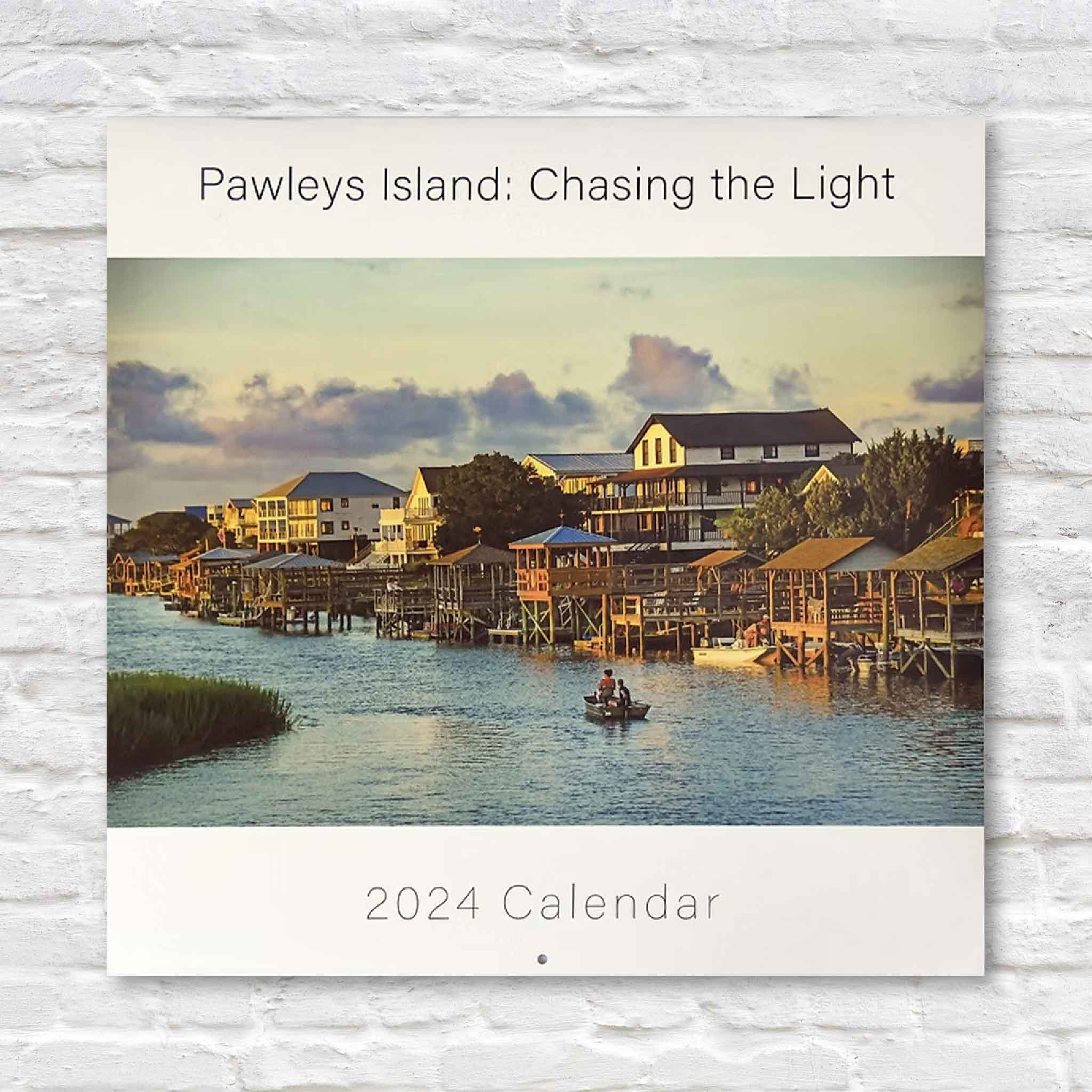 2024 Pawleys Island Chasing the Light photography calendar by local artist Tanya Ackerman, featuring a coastal inlet scene, available at Gray Man Gallery.