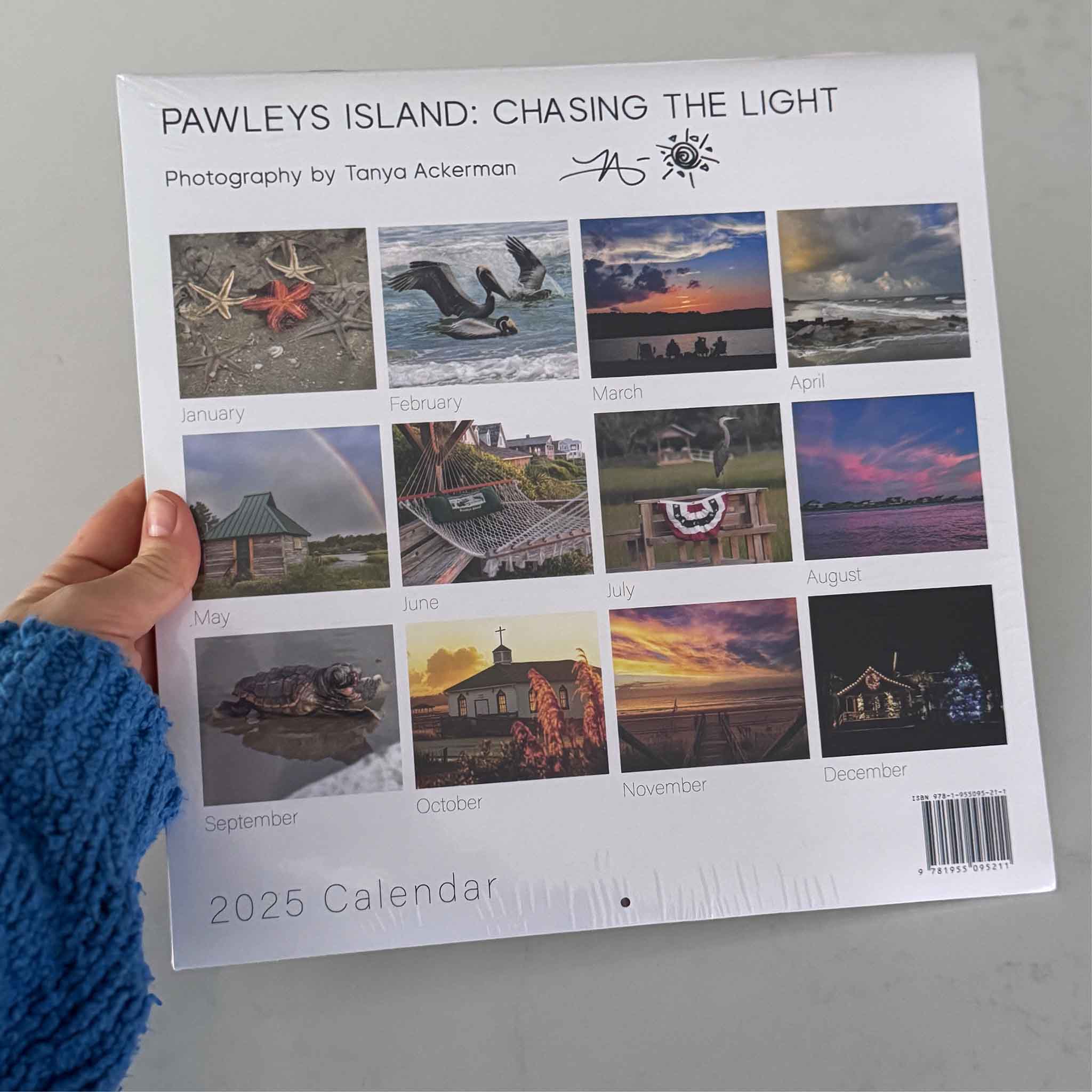 Back view of the 2025 Pawleys Island photography calendar by local artist Tanya Ackerman showing all monthly images, available at Gray Man Gallery.