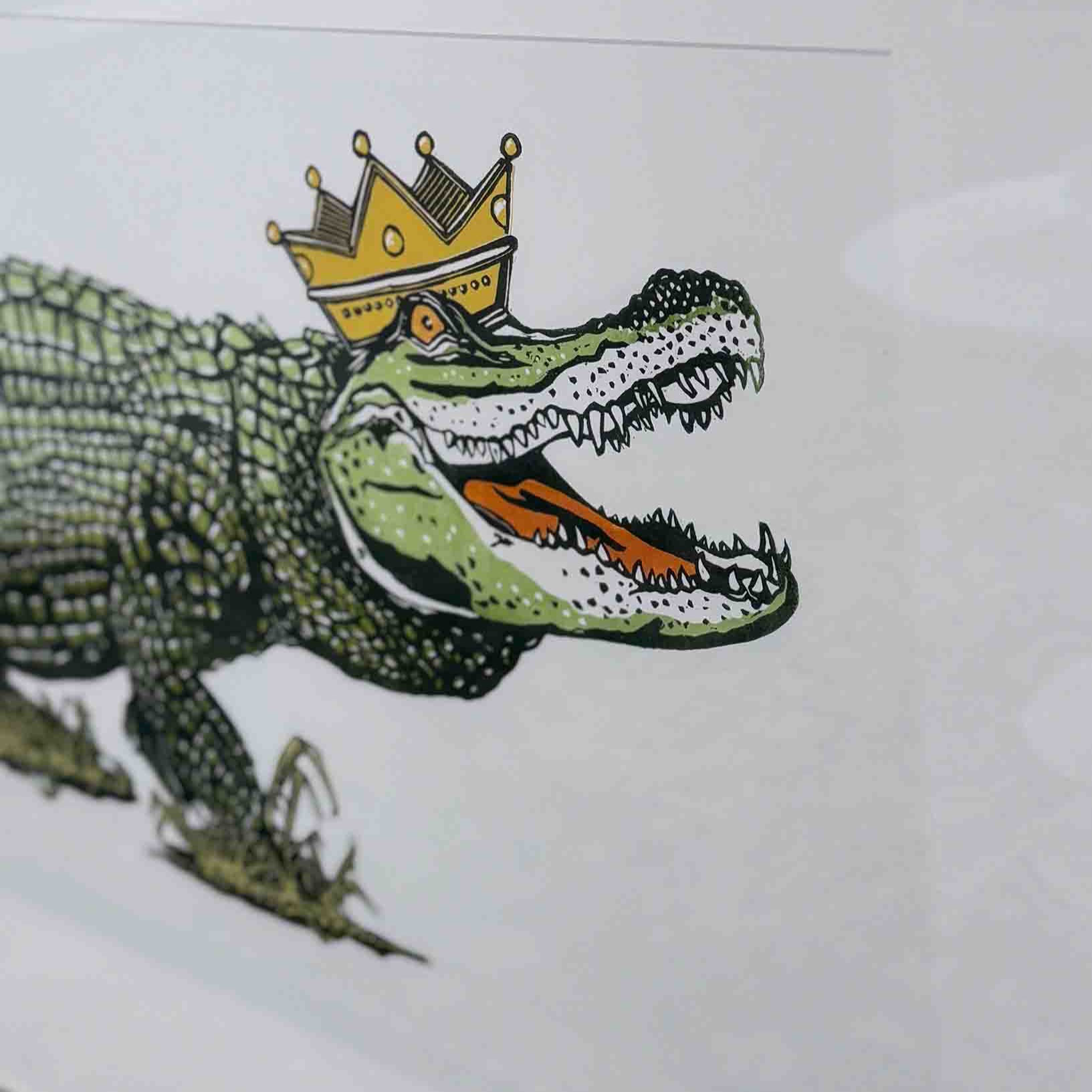 Illustration of an alligator wearing a crown on a white background