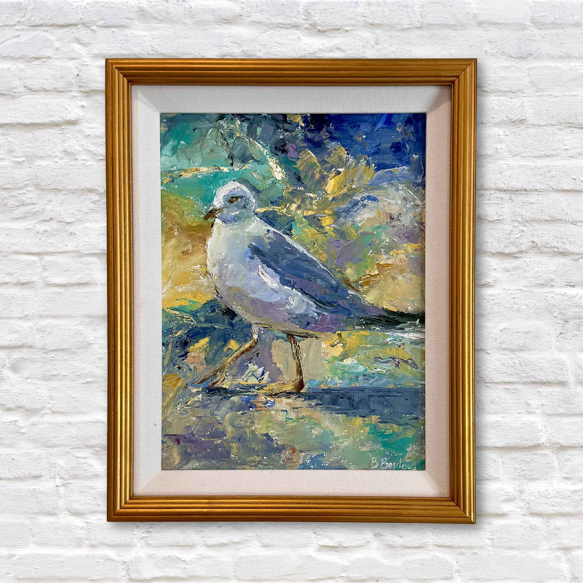 framed oil painting of a sea gull with a colorful background on a white brick wall