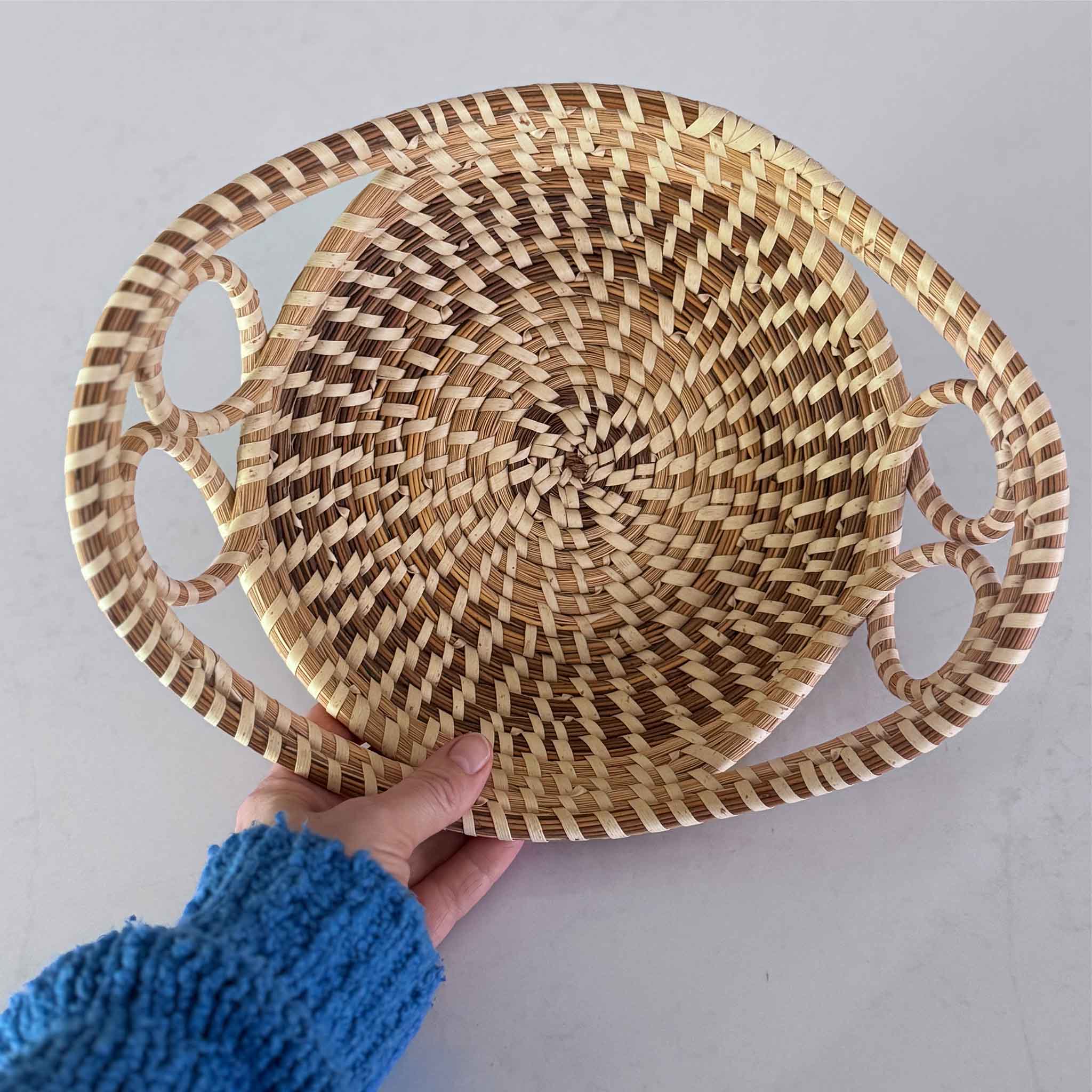 Woven Charleston sweetgrass basket with handles at Gray Man Gallery