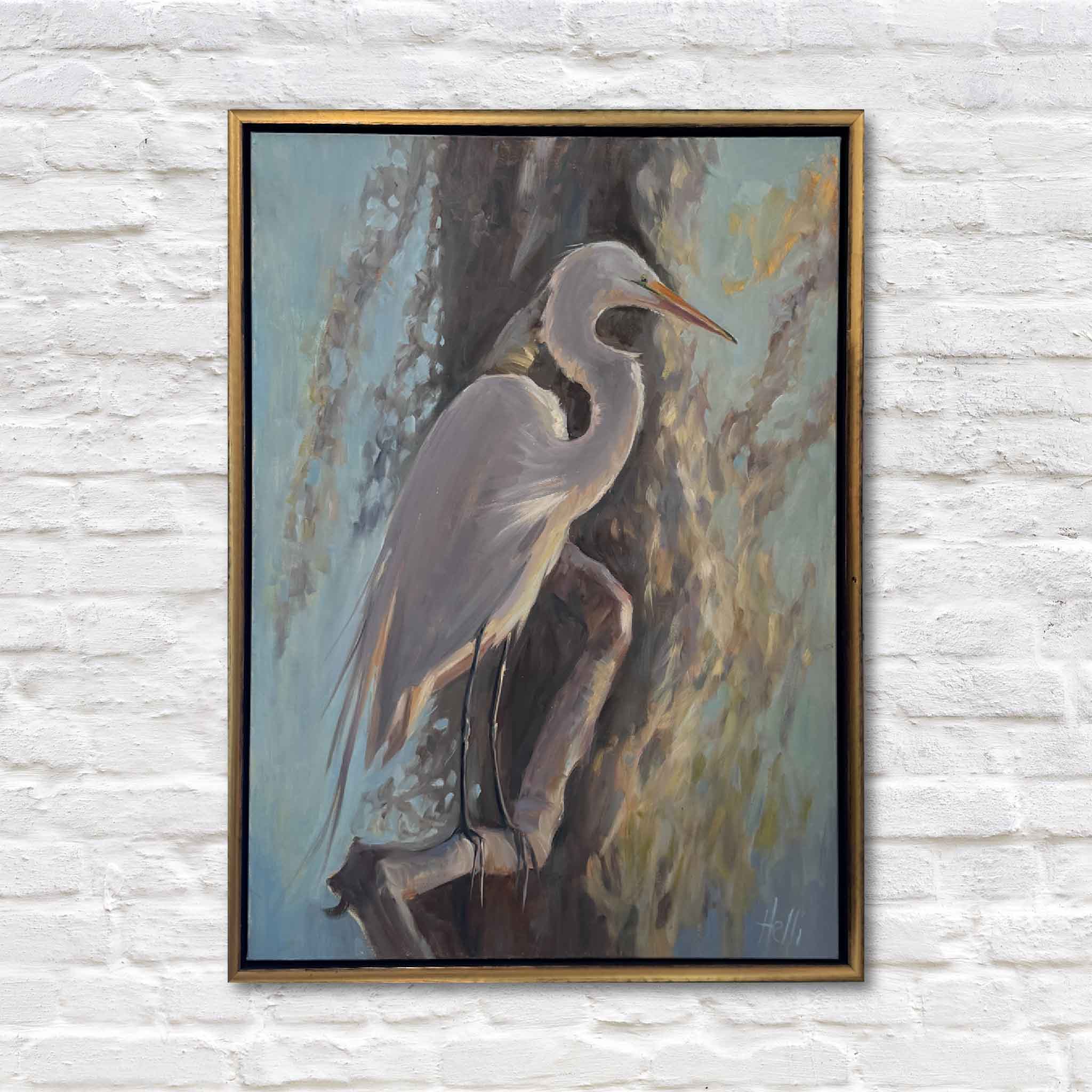 framed white egret oil painting on white brick wall