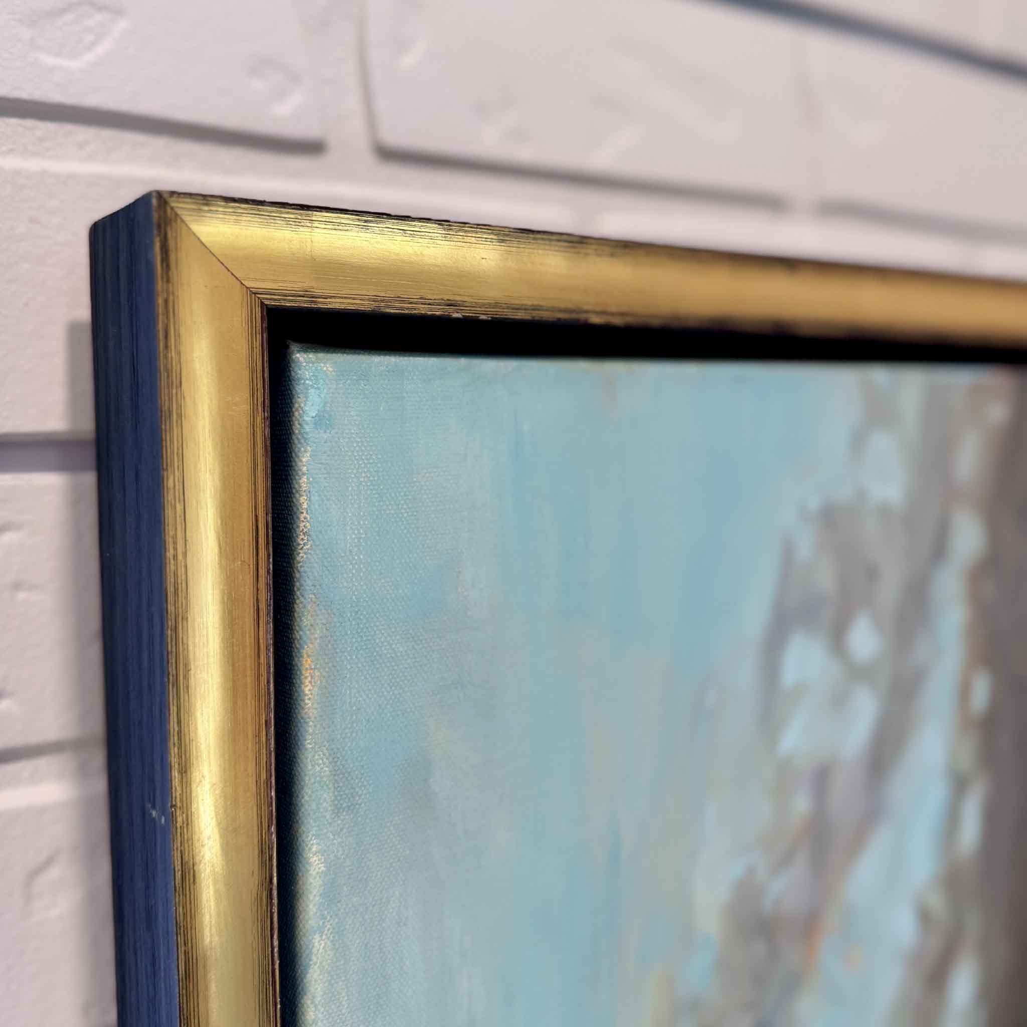gold frame of oil painting on white brick wall