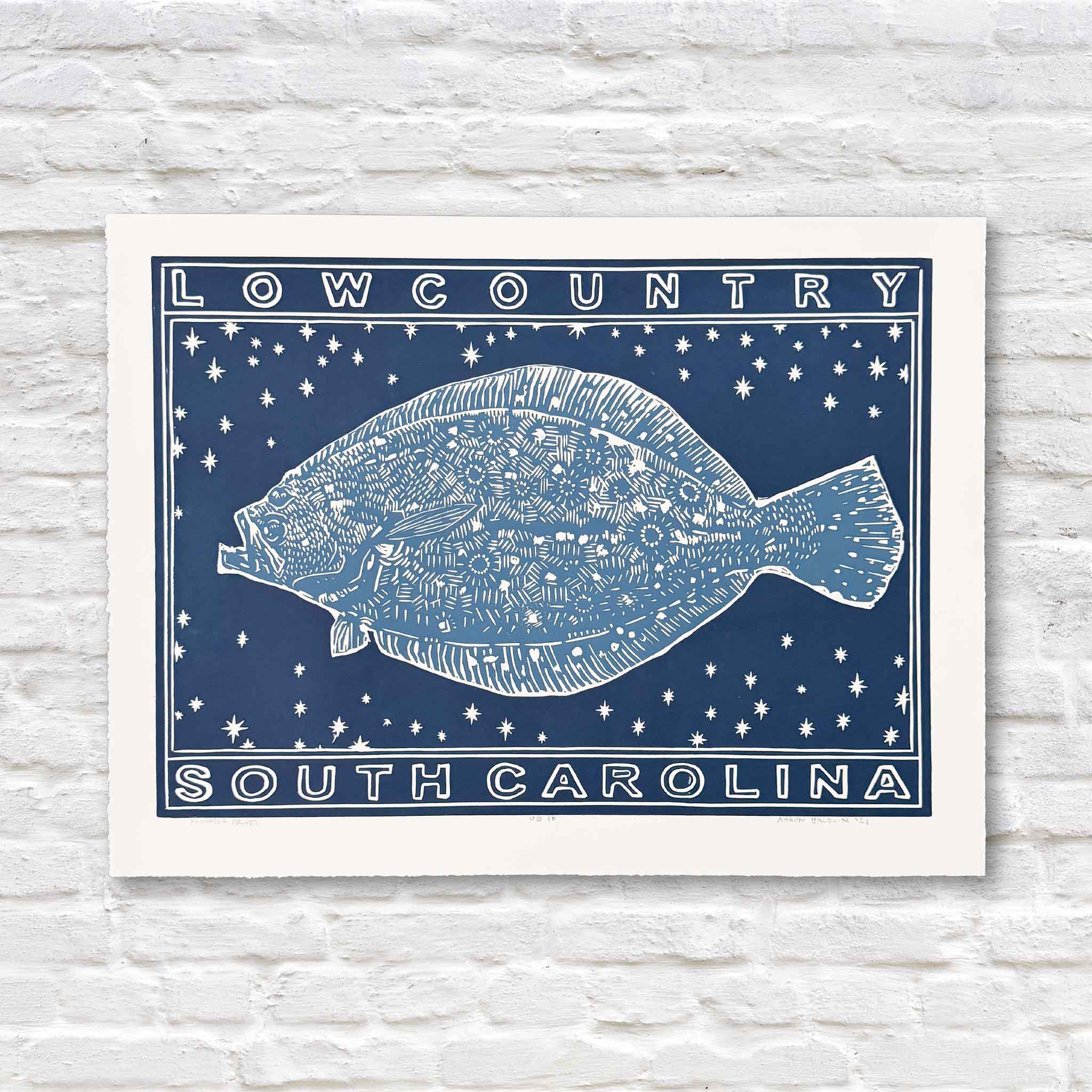 Blue linocut artwork of flounder on a white brick background