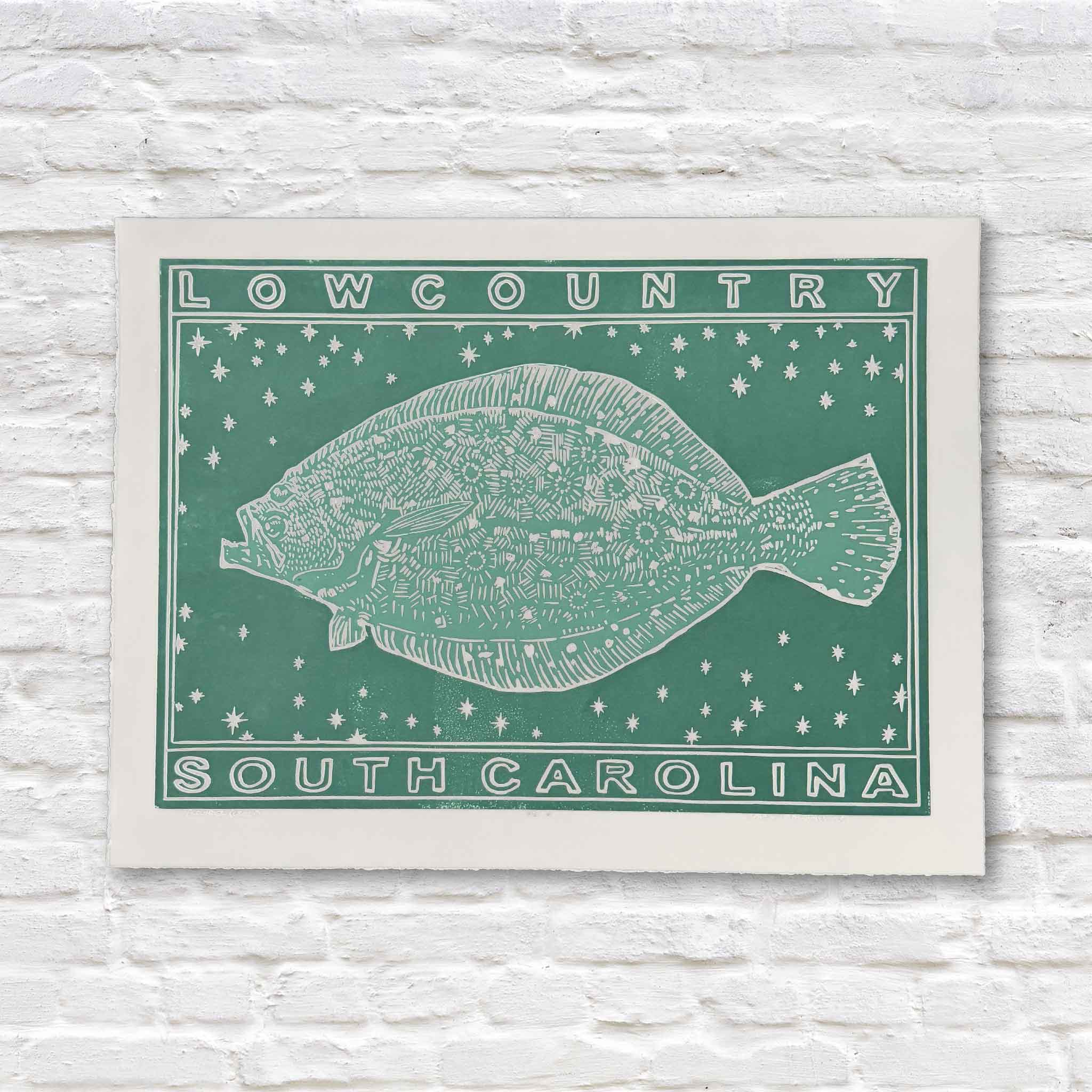 Green linocut artwork of flounder on a white brick background