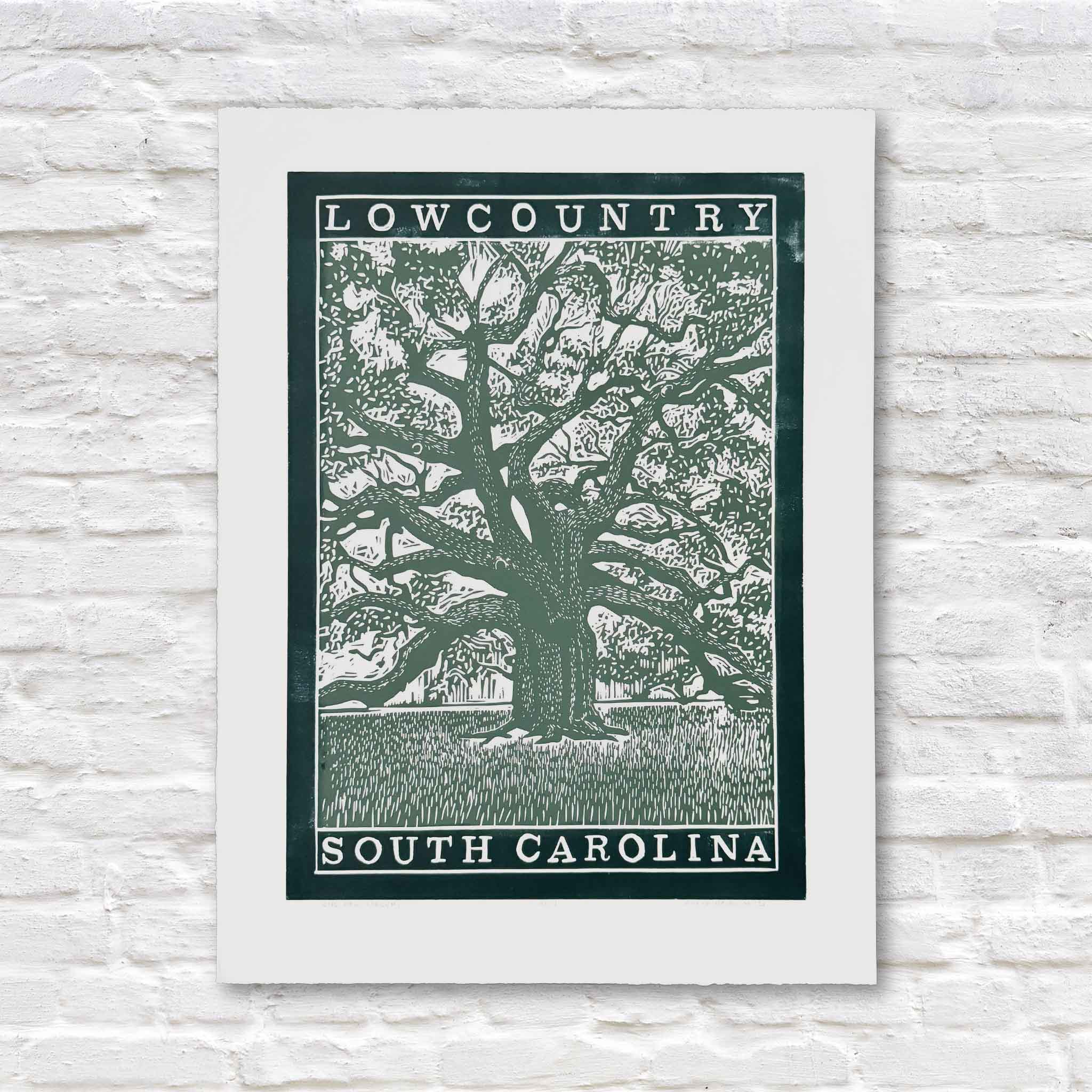green linocut artwork of a lowcountry live oak tree on a white brick background