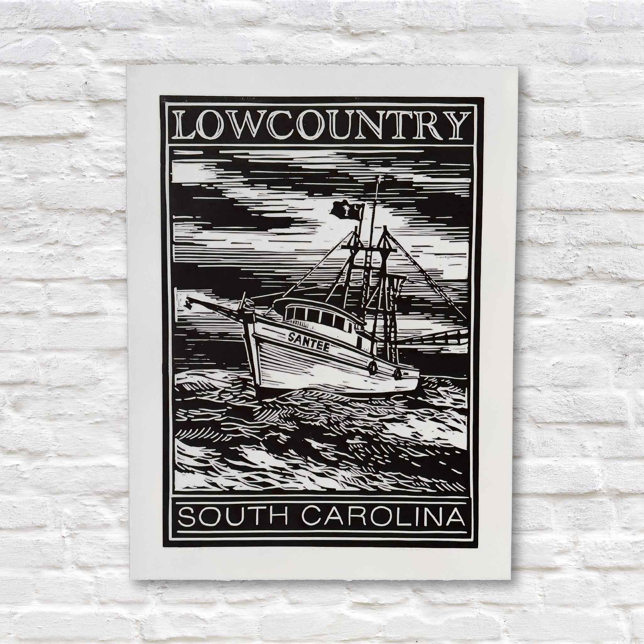 black linocut artwork of lowcountry shrimp boat on a white brick background