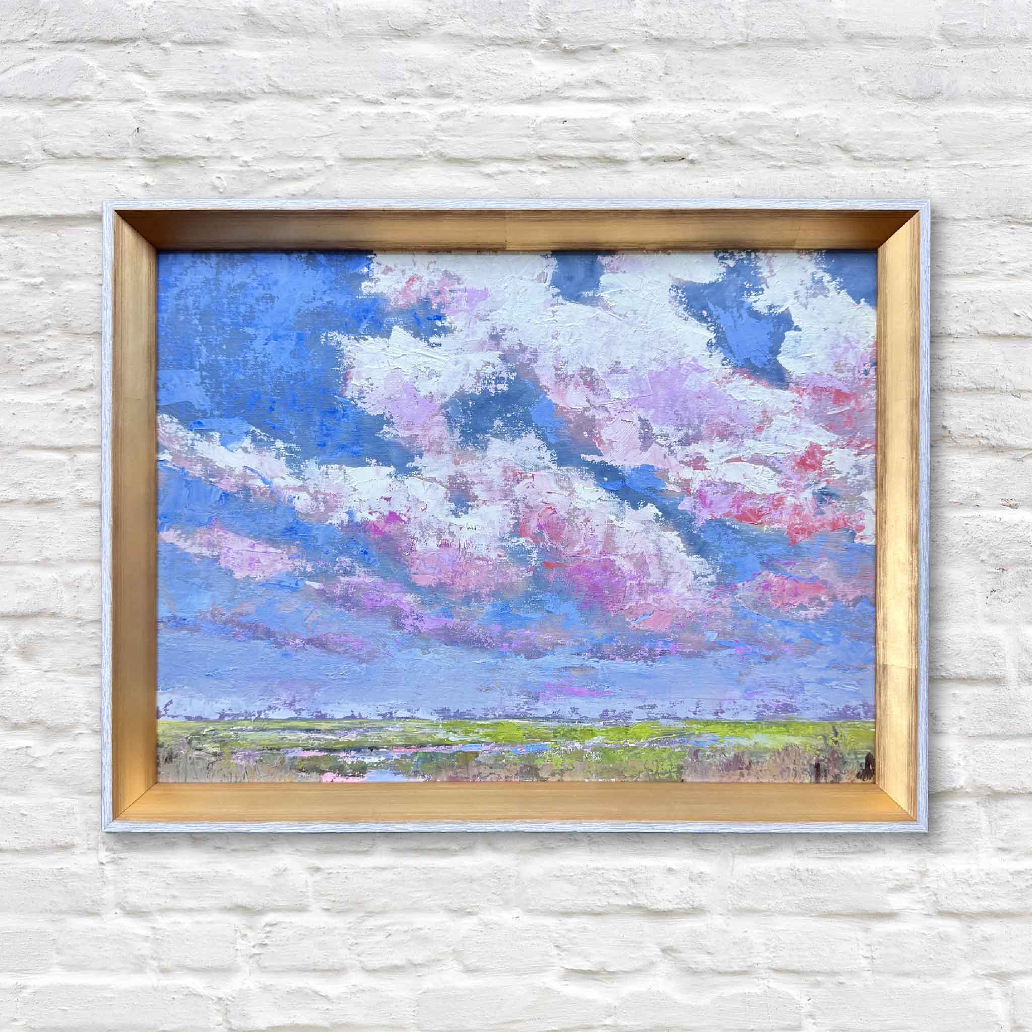 Beneath the Blushing Sky oil painting by Jeanne O’Neal, Lowcountry marsh landscape with vivid pink clouds and blue sky, framed in gold, exclusive to Gray Man Gallery