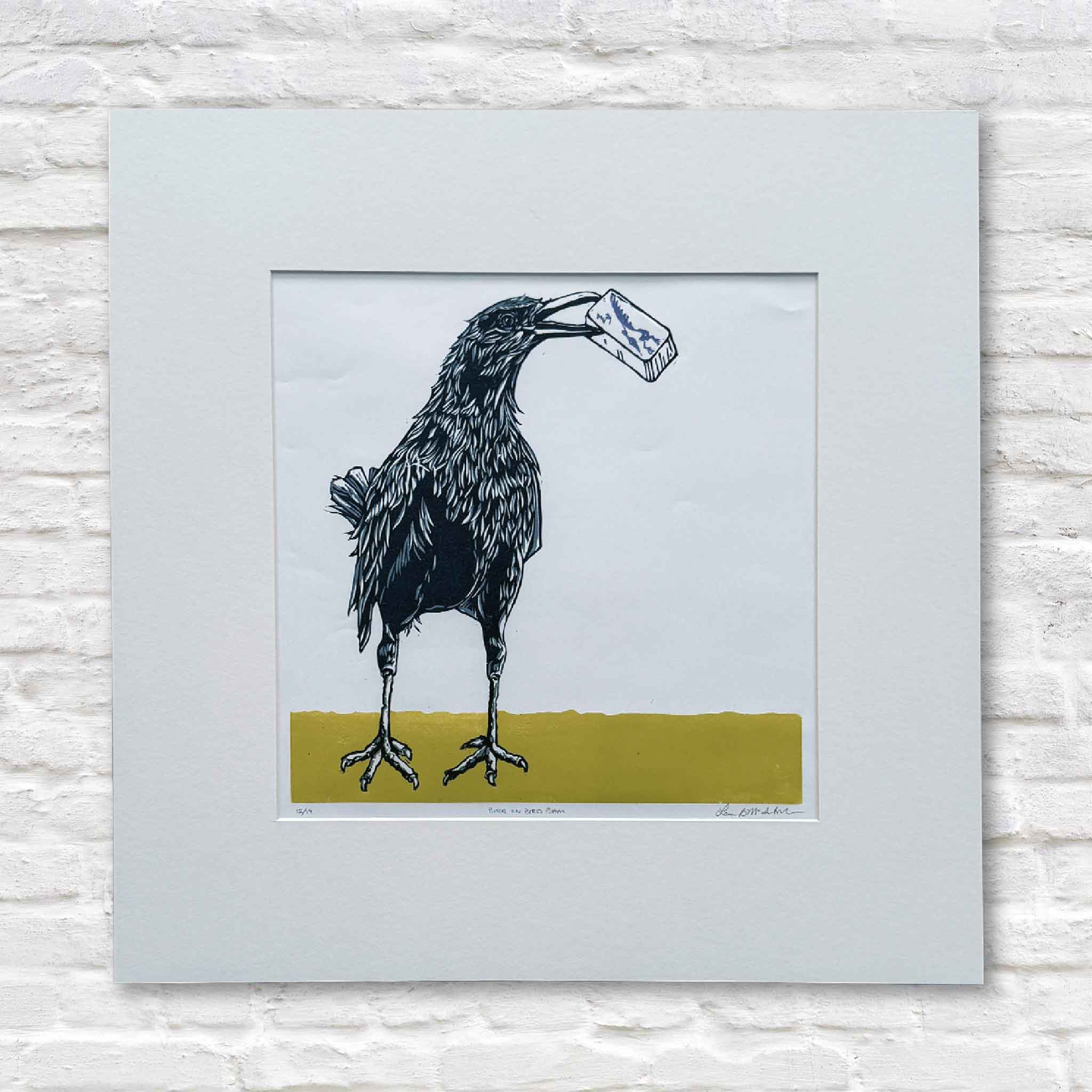 Original linocut by Laurie McIntosh featuring a blackbird carrying a Bam mahjong tile, signed and numbered, matted to 20×20 inches.