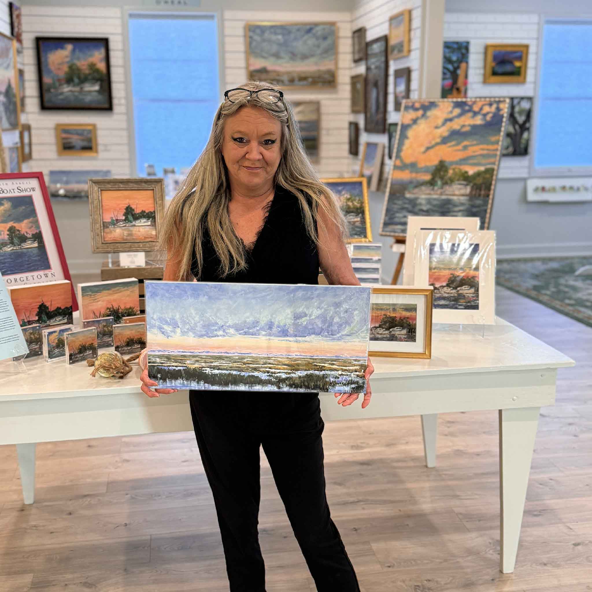 Giclée print of Jeanne O’Neal’s “Classy,” a panoramic Lowcountry marsh sunset with soft pastel skies and reflective water. Pictured at Gray Man Gallery.