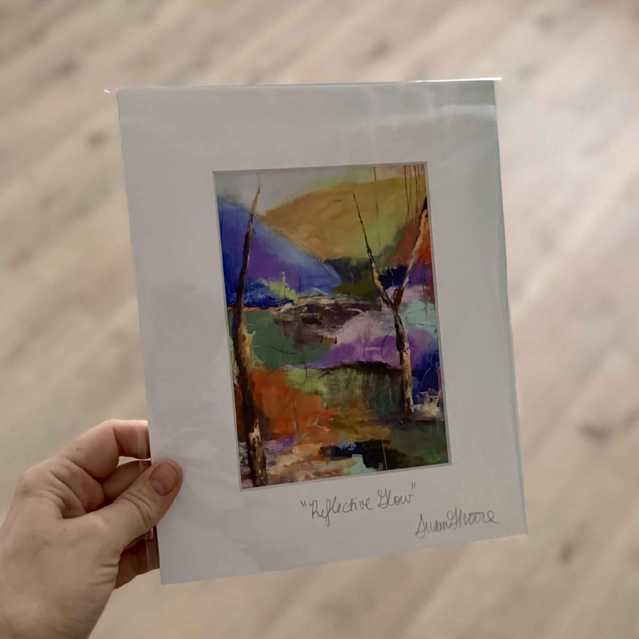 8x10 matted fine art giclée print Reflective Glow by Susan Moore featuring an abstract coastal landscape with bold tones of orange, teal, violet, and gold.