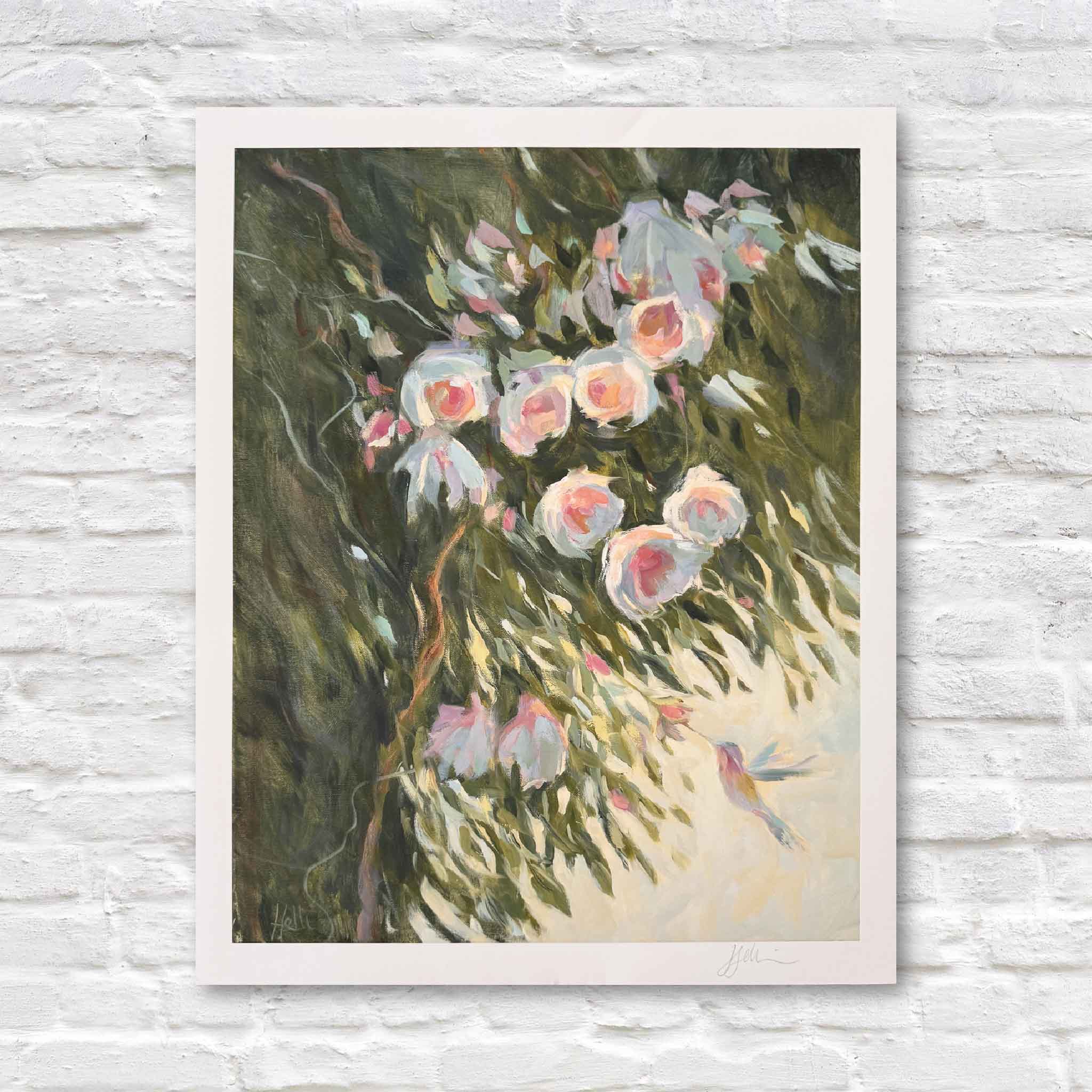 Matted print of pink flowers and a hummingbird on a textured white wall