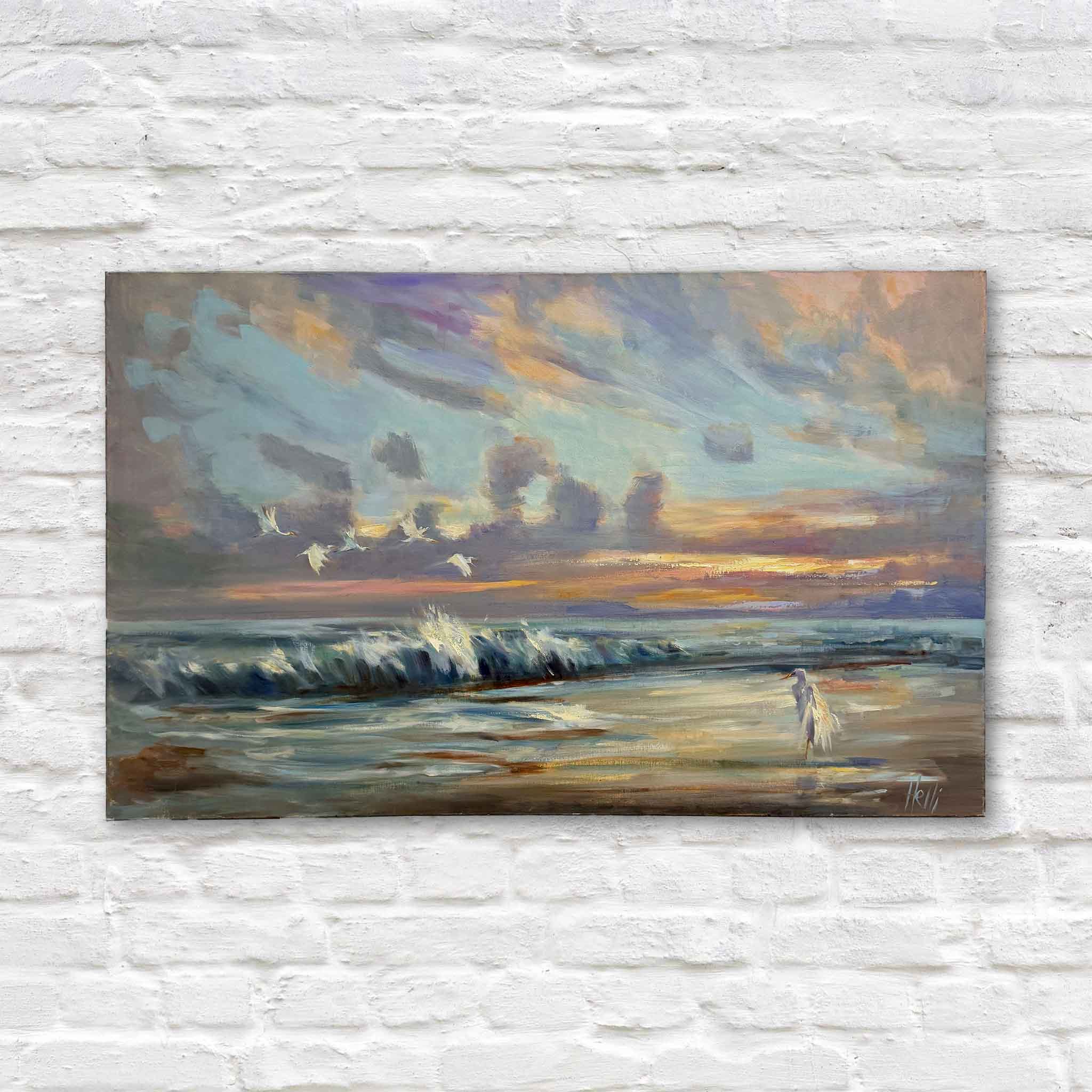 large coastal oil painting by Helli Luck showing sunrise over ocean waves with an egret on the shoreline