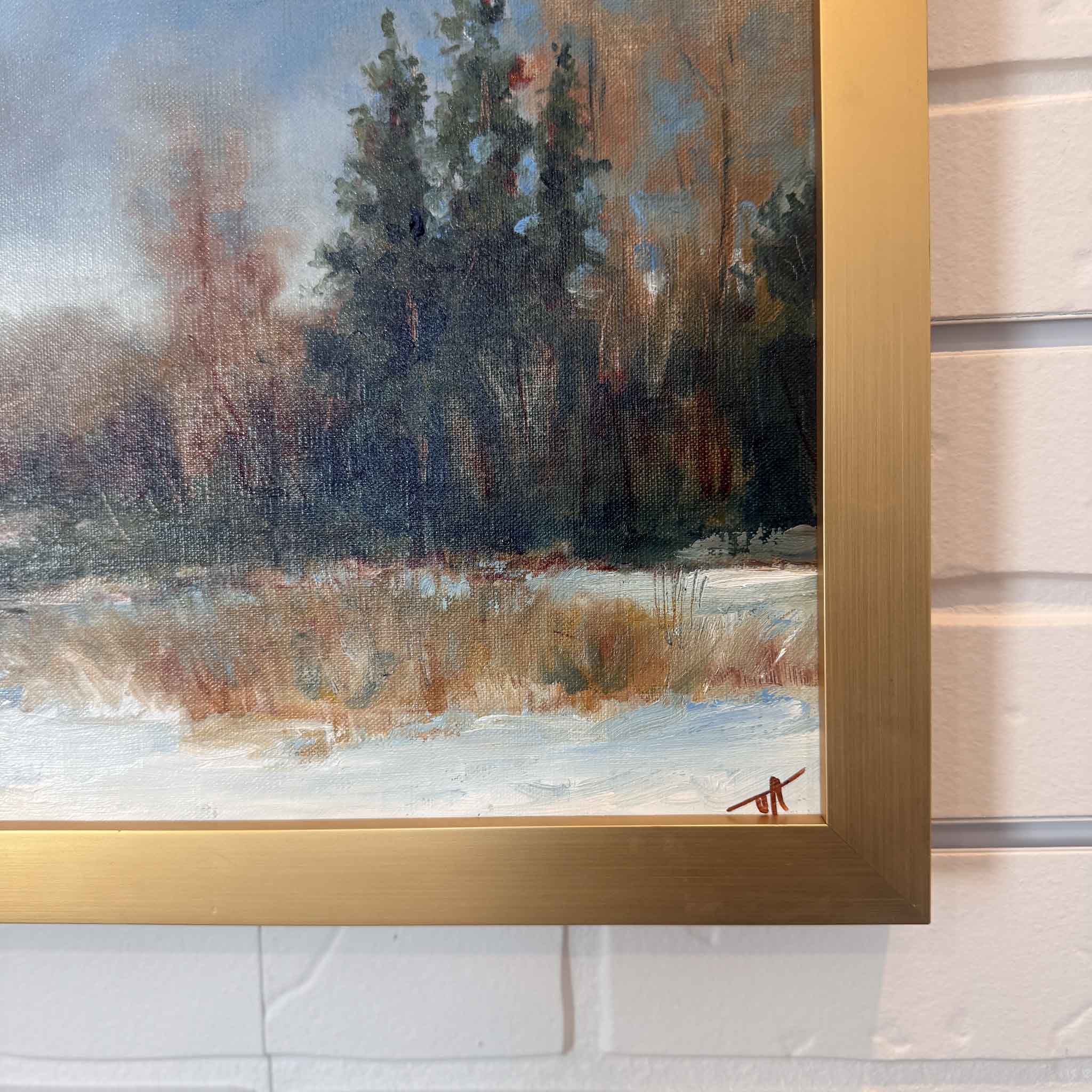 Framed oil painting Winter Dreams by meteorologist and artist Jamie Arnold, featuring a peaceful snowy landscape and evergreen trees.
