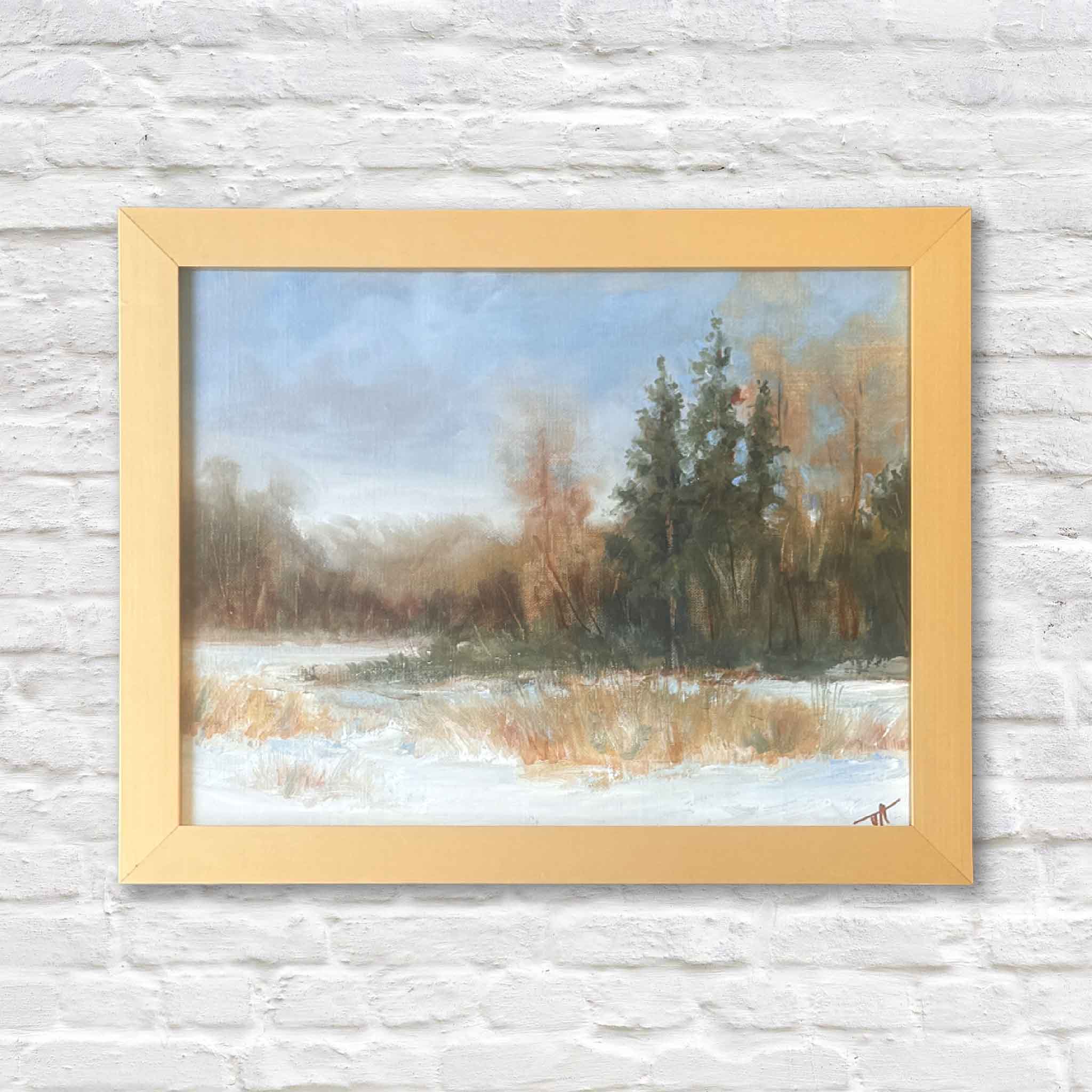 Framed oil painting Winter Dreams by meteorologist and artist Jamie Arnold, featuring a peaceful snowy landscape and evergreen trees.