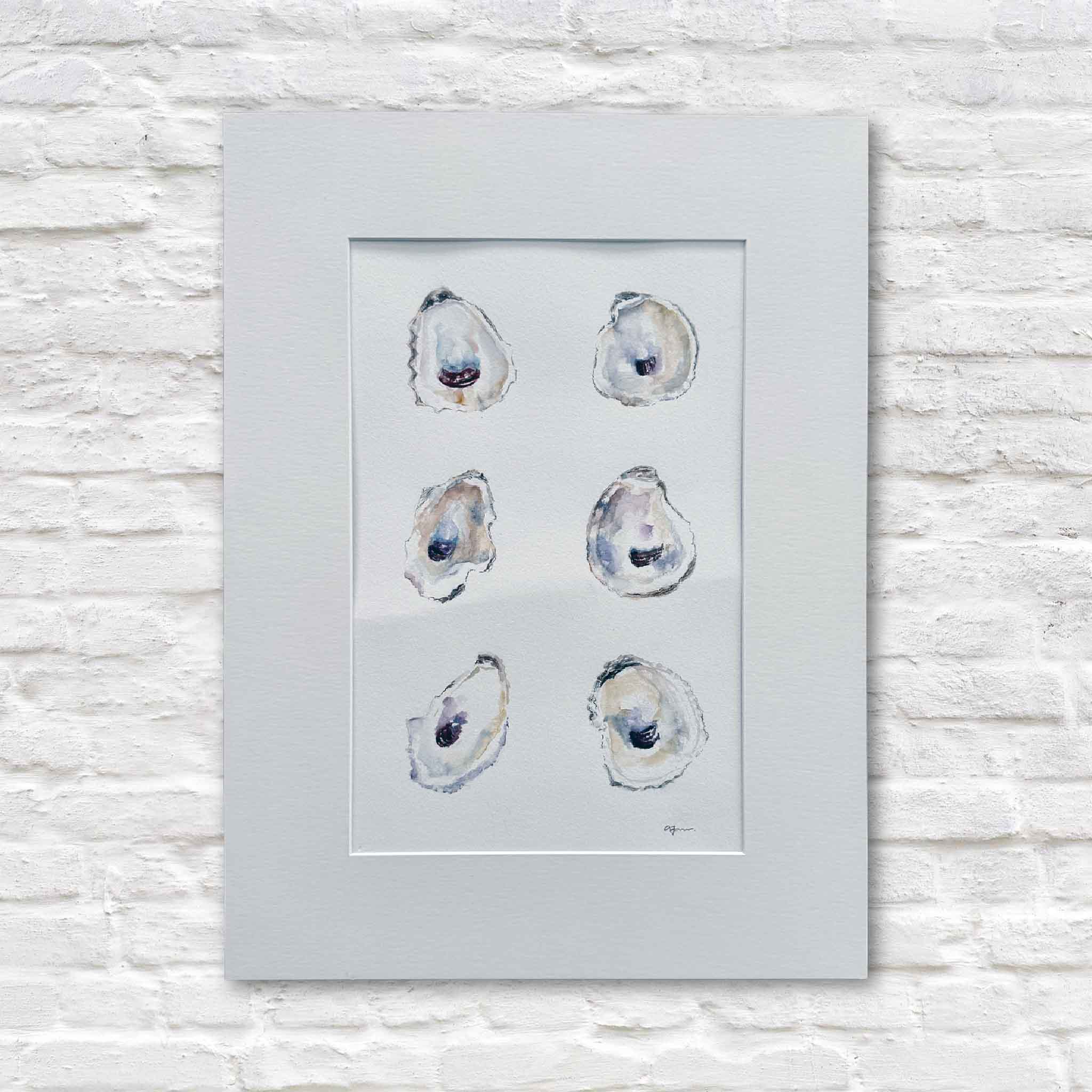 Original watercolor painting of six softly rendered oyster shells by Allison Farr, matted to 18x24 and displayed against a white brick wall.