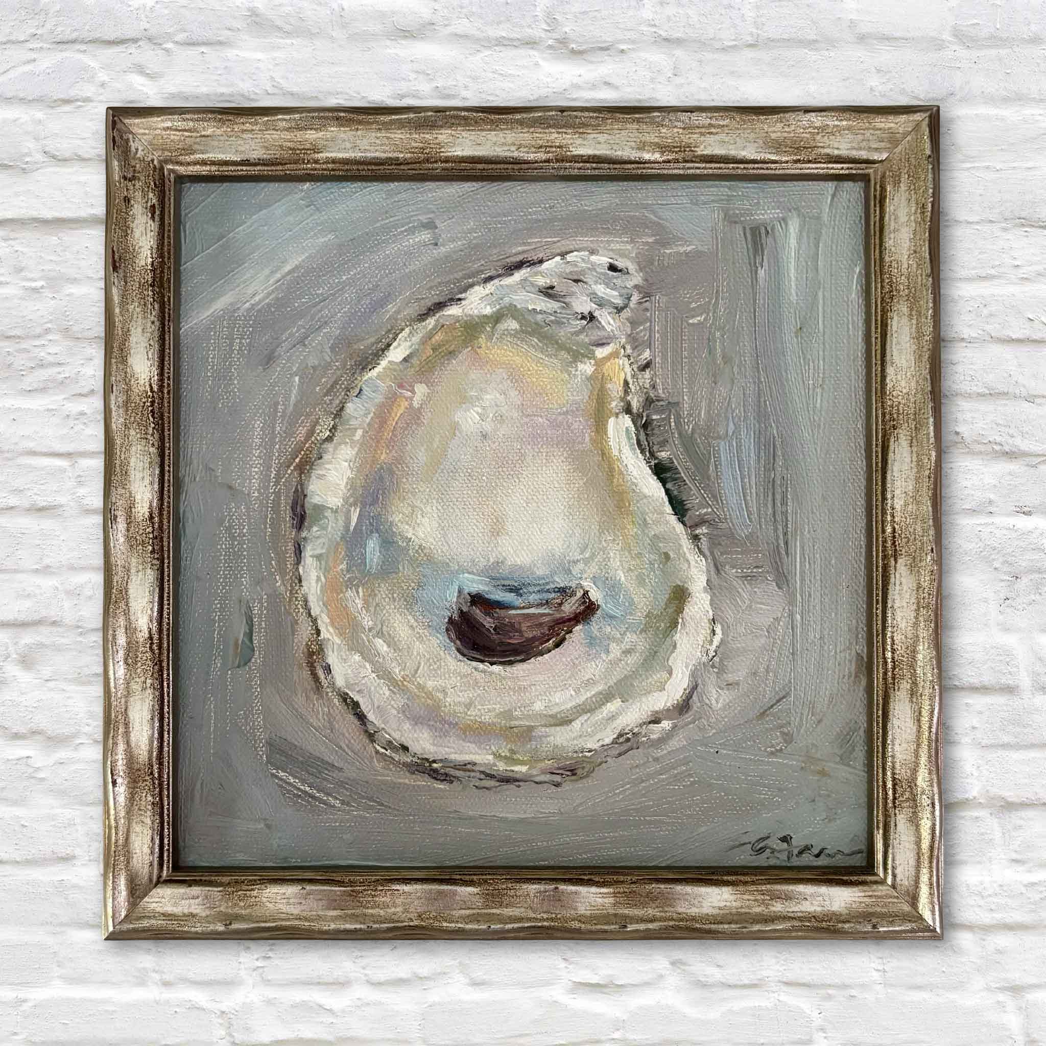 Radiance, an original oyster shell oil painting by local South Carolina artist Allison Farr, featuring luminous pearl, gold, blue, and blush tones. Professionally framed and photographed at Gray Man Gallery in Pawleys Island, South Carolina.