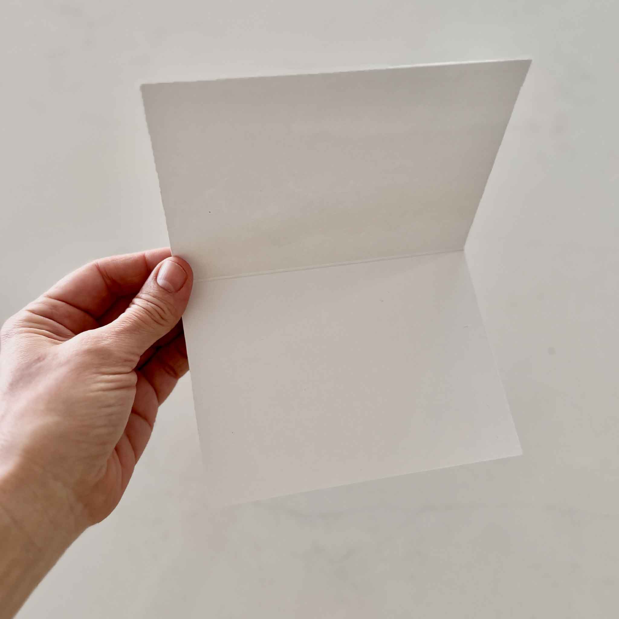 Blank interior of folded Marsh Reflections notecard featuring artwork by local Lowcountry artist Jeanne O’Neal showing the clean white writing space inside the coastal art notecard set available at Gray Man Gallery