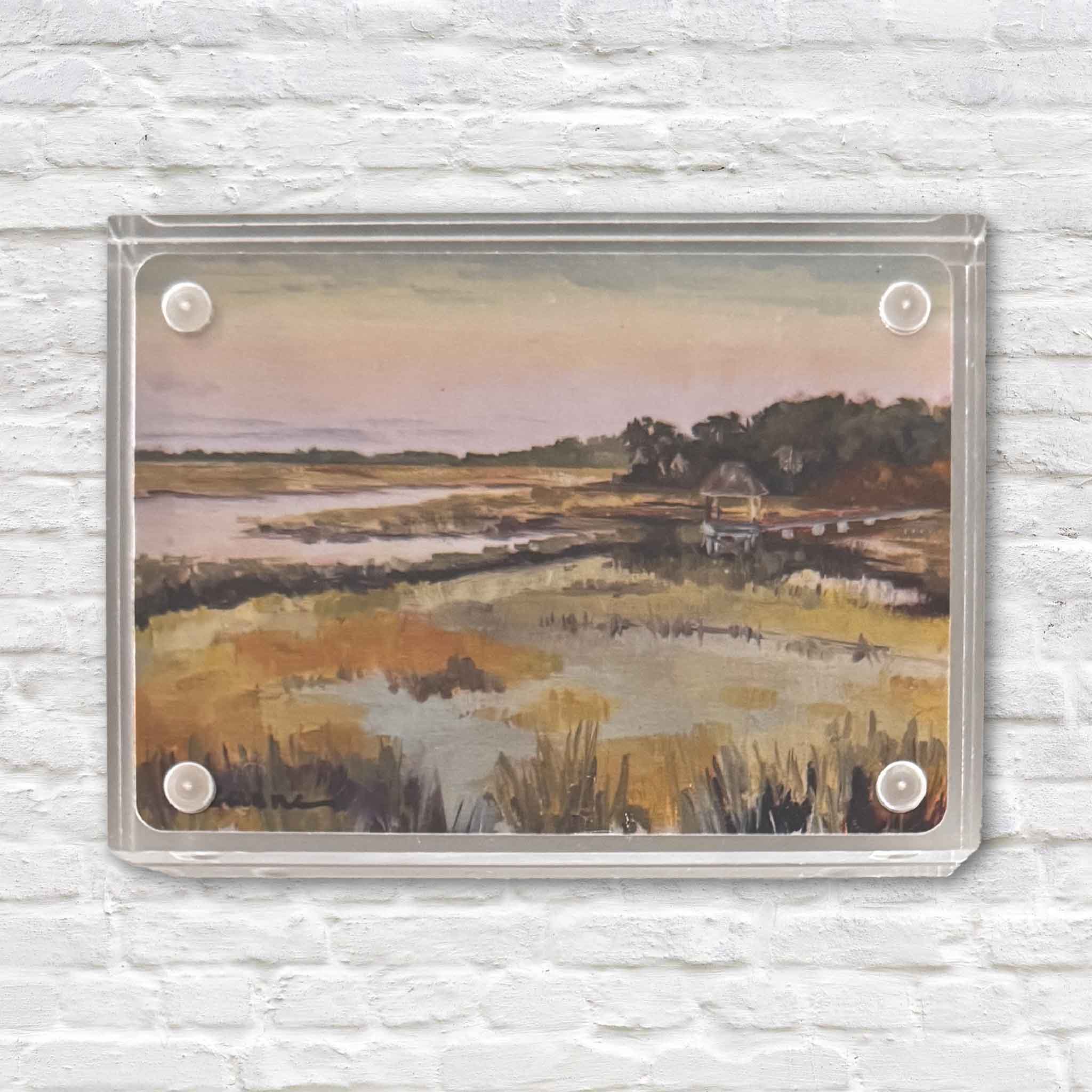 Blessed acrylic block by local artist Jeanne O’Neal, featuring a peaceful Lowcountry marsh scene with winding tidal creeks, golden grasses, and a soft coastal sky, displayed in a clear acrylic block at Gray Man Gallery in Pawleys Island, South Carolina