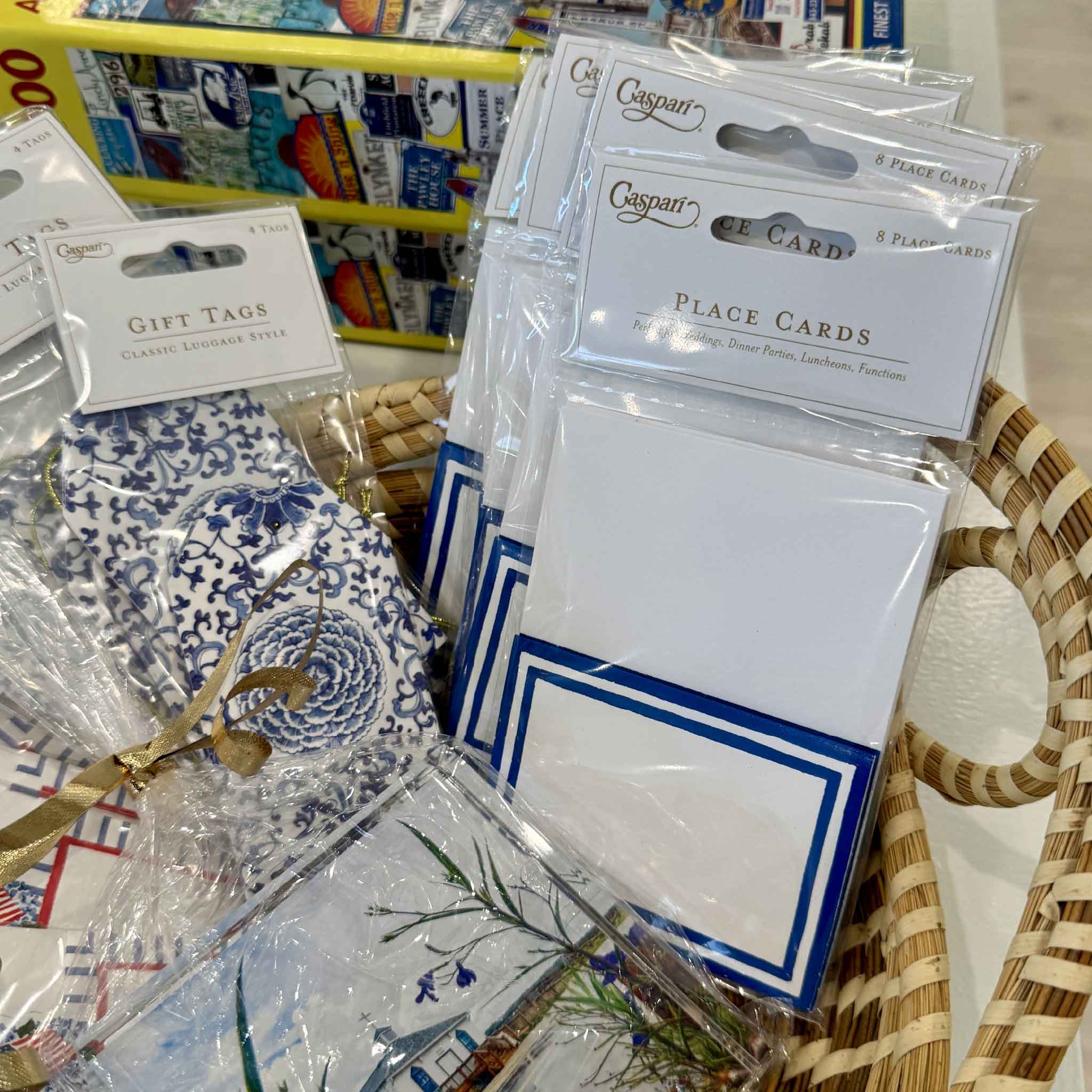 Caspari Stripe Border Blue Place Cards displayed alongside coordinating tabletop accessories, gift tags, and entertaining essentials, showcasing their timeless coastal style for elegant table settings and celebrations. Available at Gray Man Gallery in Pawleys Island, South Carolina.