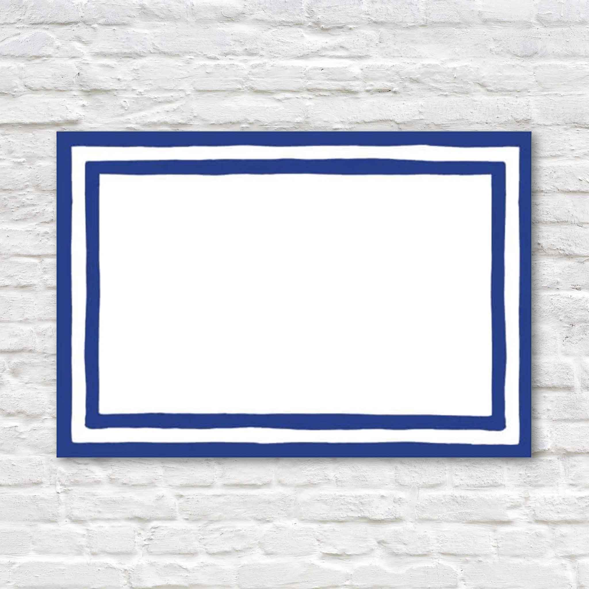 Set of eight Caspari Stripe Border Blue Foil folded place cards featuring a classic hand-painted blue border surrounding a blank white writing area. Premium heavyweight cardstock place cards for weddings, dinner parties, holiday tables, buffets, and elegant entertaining, available at Gray Man Gallery in Pawleys Island, South Carolina.