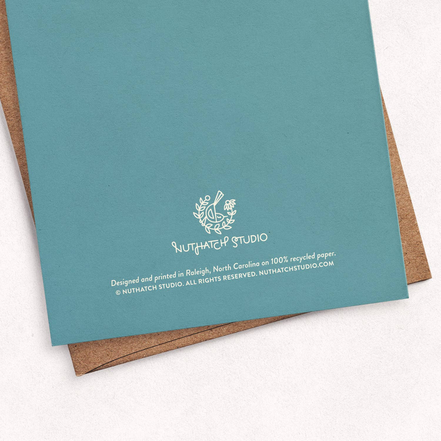 Back of the Chickadee Thank You greeting card by Chrissie Van Hoever showing Nuthatch Studio branding and recycled kraft envelope. This sustainably made greeting card is available at Gray Man Gallery in Pawleys Island, South Carolina.