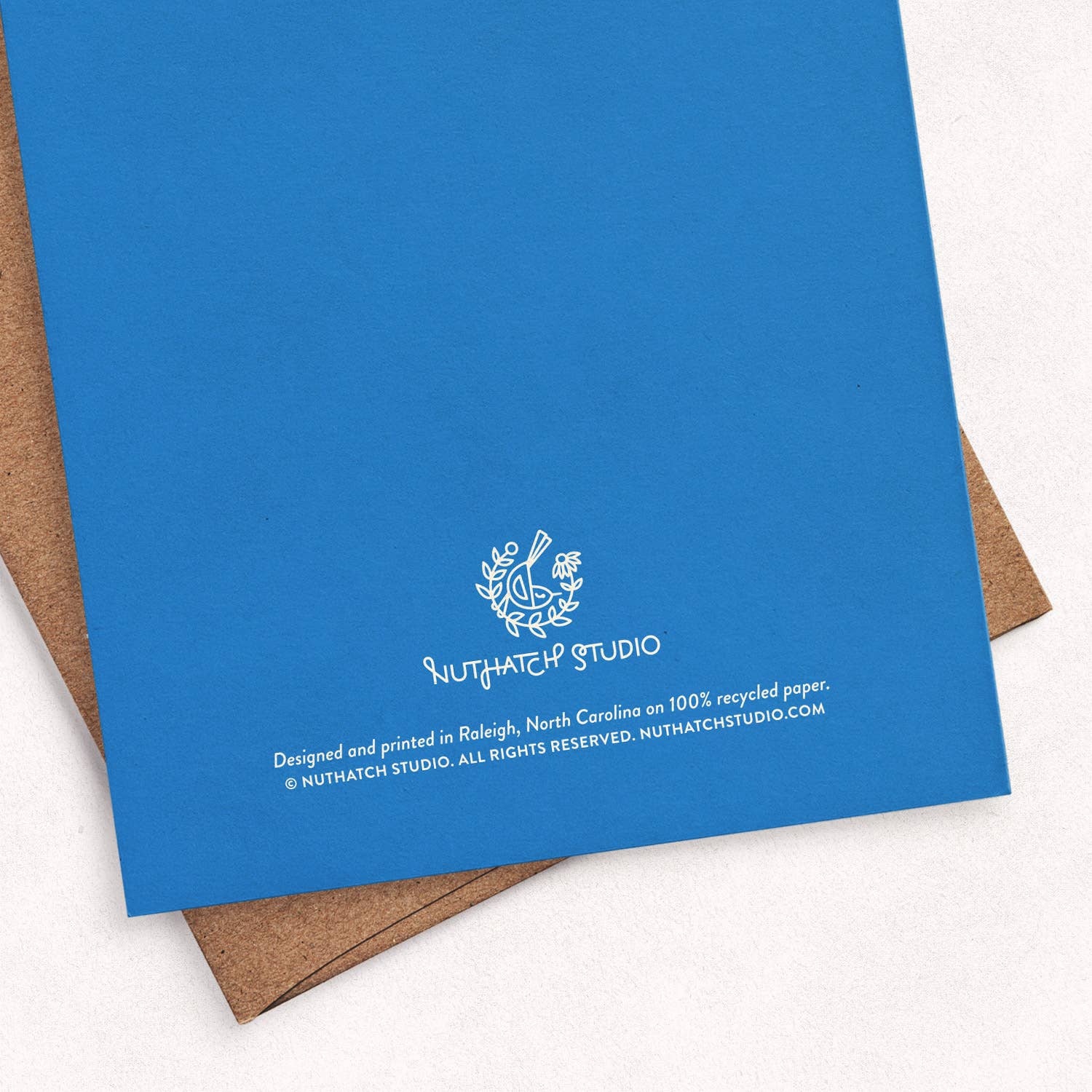Back of the Bennie Blooms greeting card by Chrissie Van Hoever showing Nuthatch Studio branding and recycled kraft envelope. This sustainably printed eco-friendly greeting card is available at Gray Man Gallery in Pawleys Island, South Carolina.