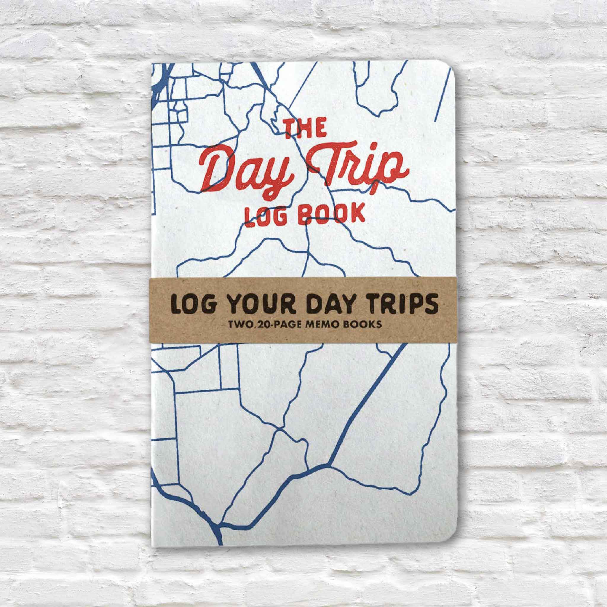 Daytrip Log Book featuring two pocket-sized travel journals for recording road trips, favorite destinations, hidden gems, local restaurants, shops, attractions, and memorable adventures. Available at Gray Man Gallery in Pawleys Island, South Carolina.