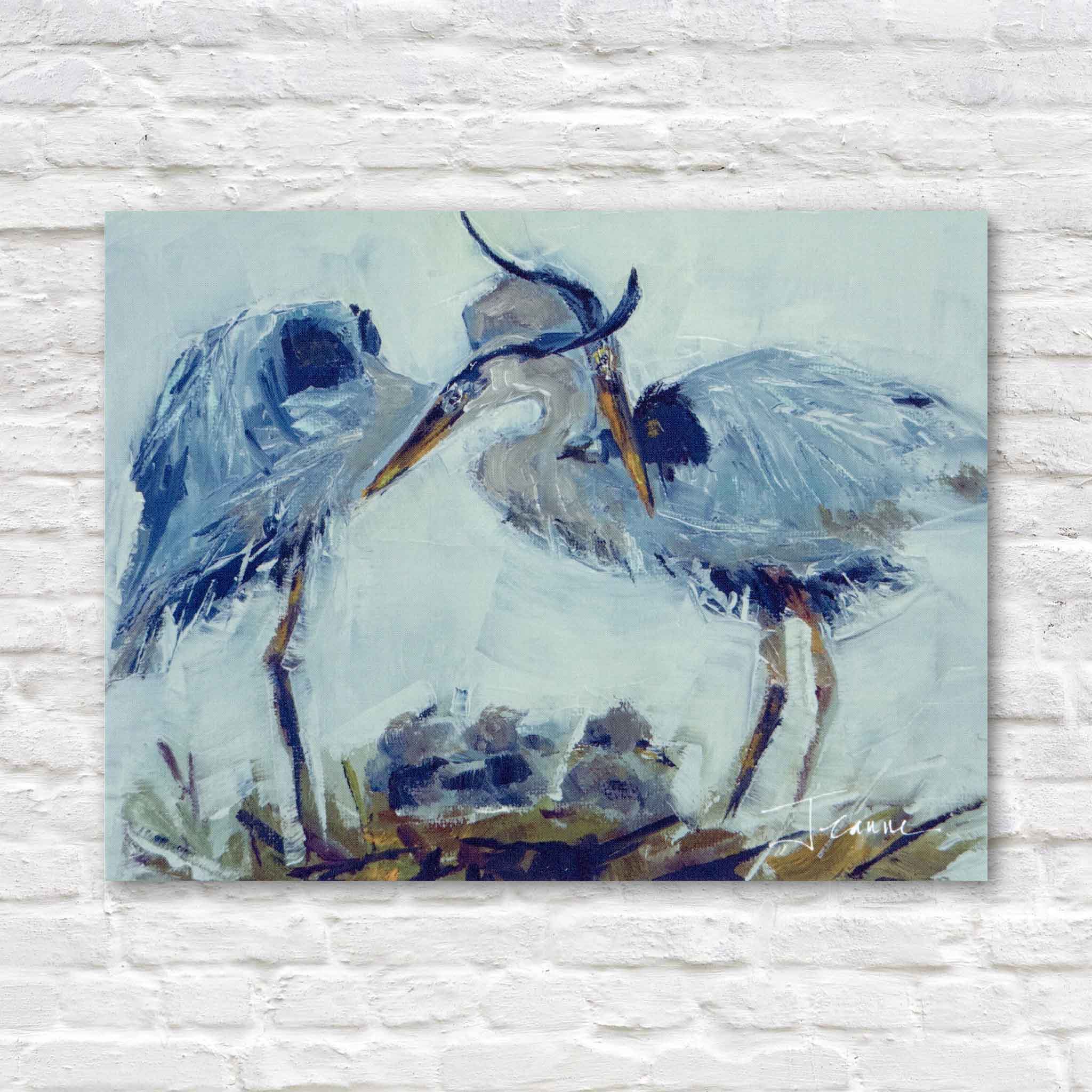 The Family blue heron nest painting by beloved Lowcountry local artist Jeanne O’Neal featuring two adult blue herons standing protectively over their chicks in a marsh nest, artwork available as prints and gifts at Gray Man Gallery in Pawleys Island South Carolina