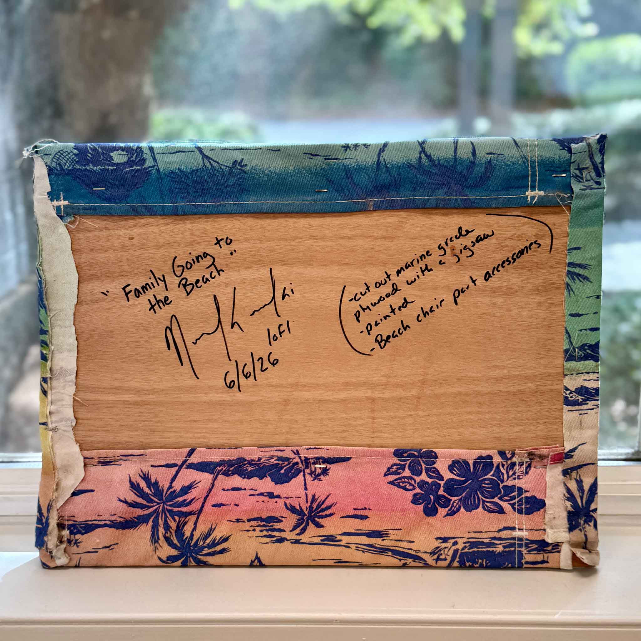 Back of Family Going to the Beach mixed media sculpture by Charleston artist Nick Kawczynski showing artist signature, date, and construction using reclaimed beach chair fabric and wood components.