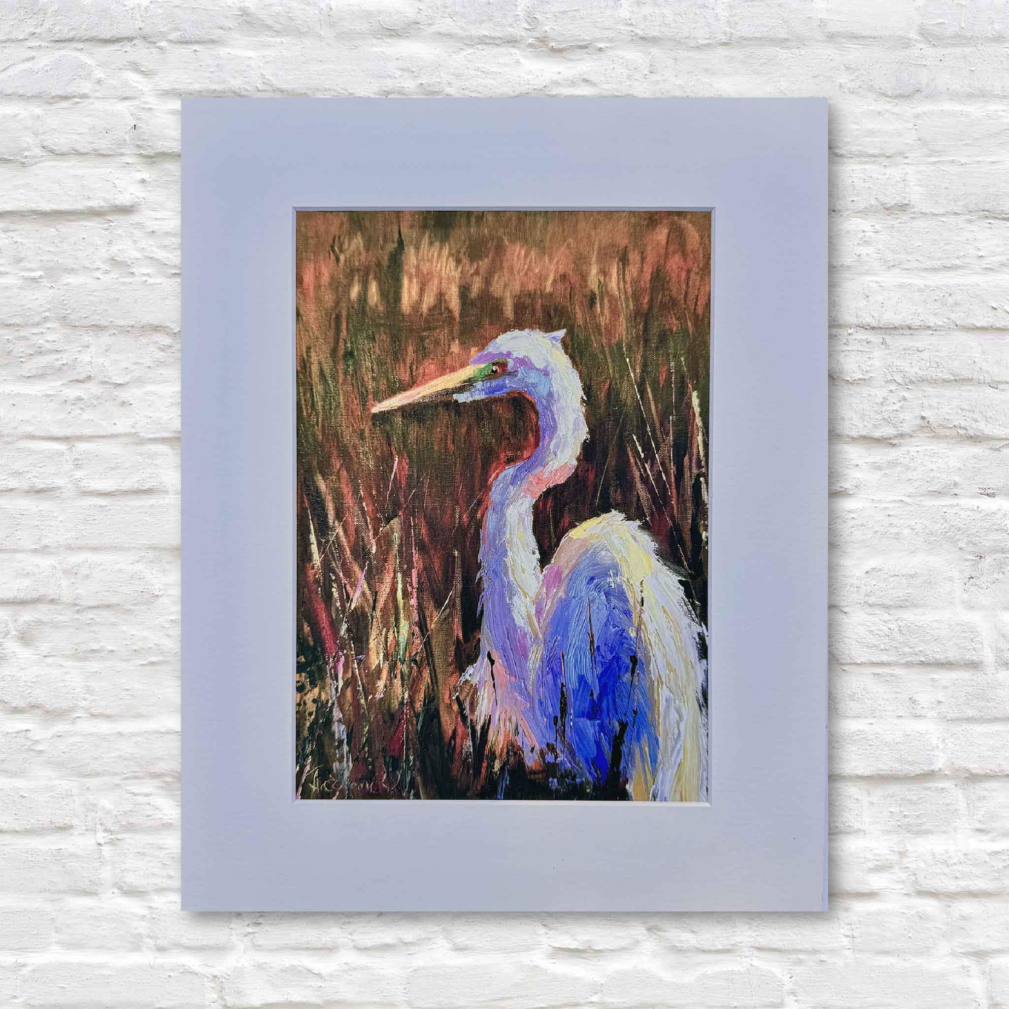 Golden Marsh Light fine art giclée print by Jeanne O’Neal featuring a coastal egret standing in glowing Lowcountry marsh grasses, matted to fit 11x14 frame, photographed at Gray Man Gallery in Pawleys Island, South Carolina, showcasing local coastal artwork and Southern landscape art