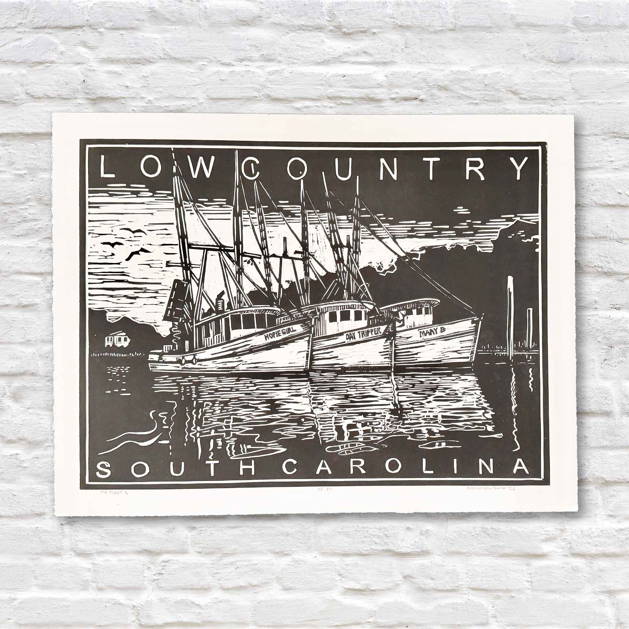 Original hand-carved linocut by local South Carolina artist Aaron Baldwin titled The Fleet II, depicting three Lowcountry shrimp boats resting in calm harbor waters, available at Gray Man Gallery