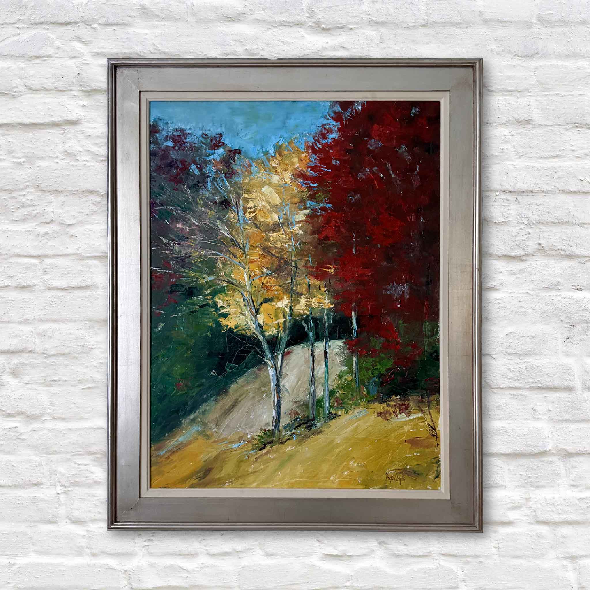 Rich Hues, an original oil painting by Betsy Boyle, featuring vibrant autumn foliage in gold, crimson, and green, custom framed by Gray Man Gallery.