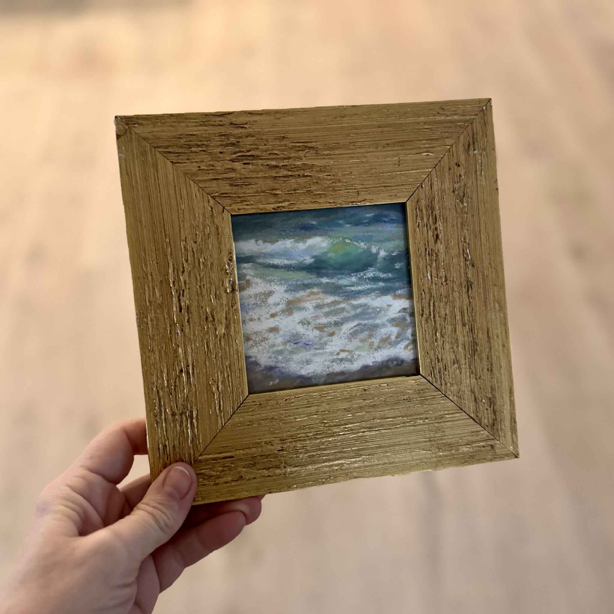 Sparkle by Joanne Willoughby shown held in hand for scale, a small original pastel artwork capturing Lowcountry coastal light and movement in a 4x4 format.