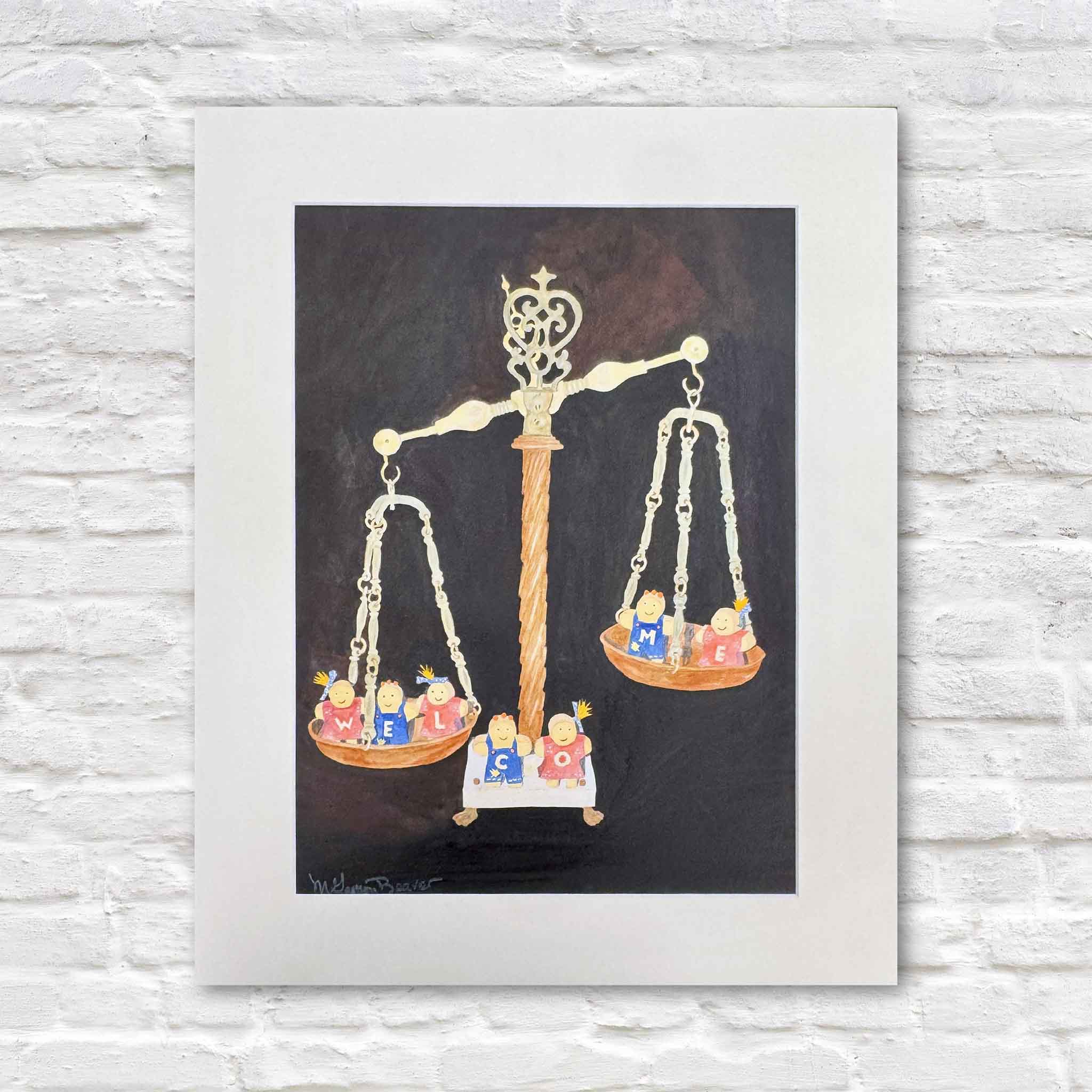 Original watercolor painting titled Welcome by Mimi Beaver, professionally matted and framed, featuring whimsical hand-painted figures spelling WELCOME on a vintage balance scale, photographed against a white brick wall at Gray Man Gallery in Pawleys Island, South Carolina.