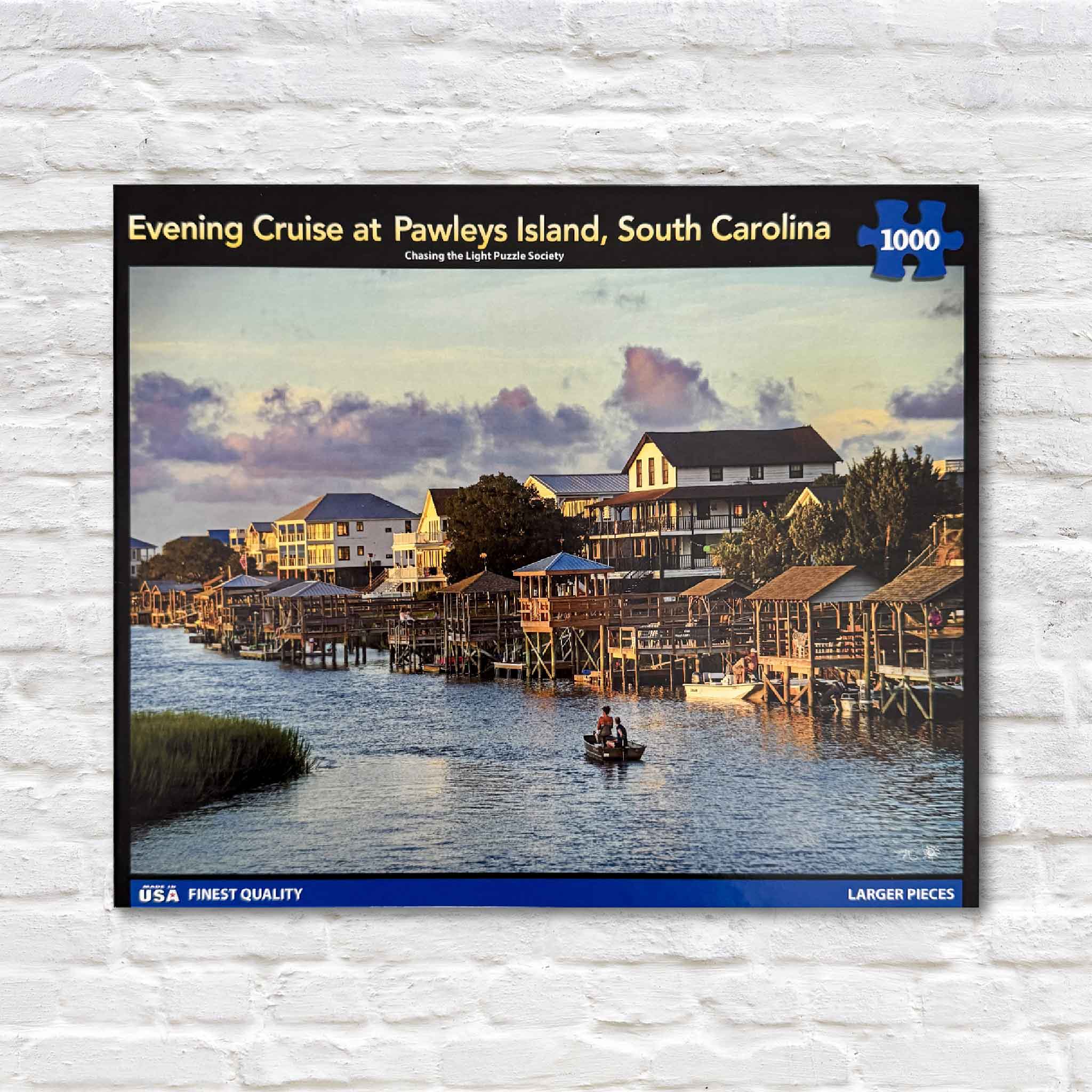 Front of the Evening Cruise at Pawleys Island 1,000-piece puzzle by Tanya Ackerman, featuring a golden sunset over creekside docks and boats on Pawleys Island.