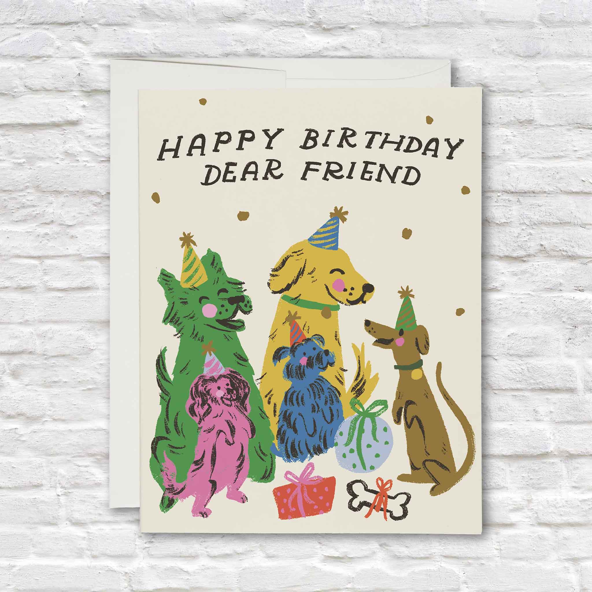 Happy Birthday Dear Friend greeting card illustrated by Dylan Mierzwinski featuring five colorful dogs wearing party hats with birthday presents and confetti. This whimsical Red Cap Cards birthday card is blank inside and available at Gray Man Gallery in Pawleys Island, South Carolina, making a cheerful choice for celebrating friends, family, dog lovers, and birthdays of all ages.