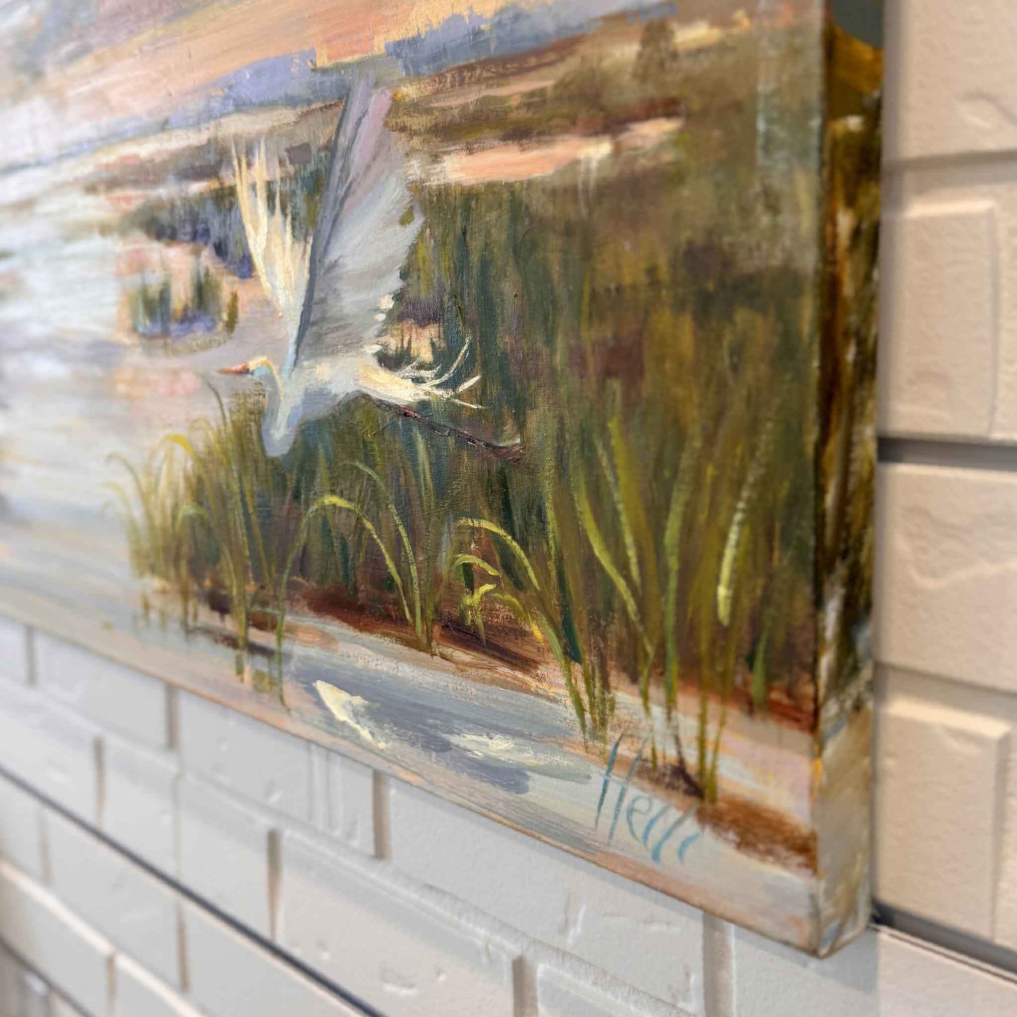 Side detail of “Rising with the Dawn,” an original oil painting by local artist Helli Luck, showing gallery-wrapped canvas edges, brushwork texture, and coastal marsh scenery at Gray Man Gallery in Pawleys Island