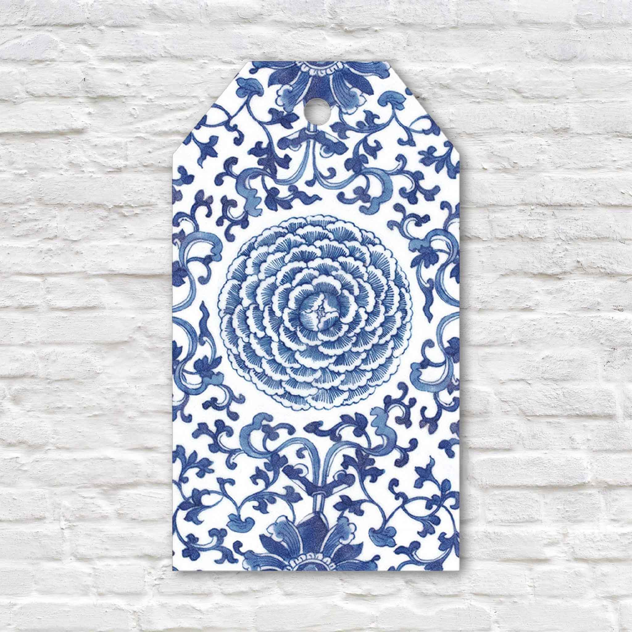 Decorative Indigo Garden blue and white hanging gift tag by Caspari featuring an elegant botanical floral pattern inspired by classic chinoiserie. Sold as a set of four decorative gift tags at Gray Man Gallery in Pawleys Island, South Carolina.