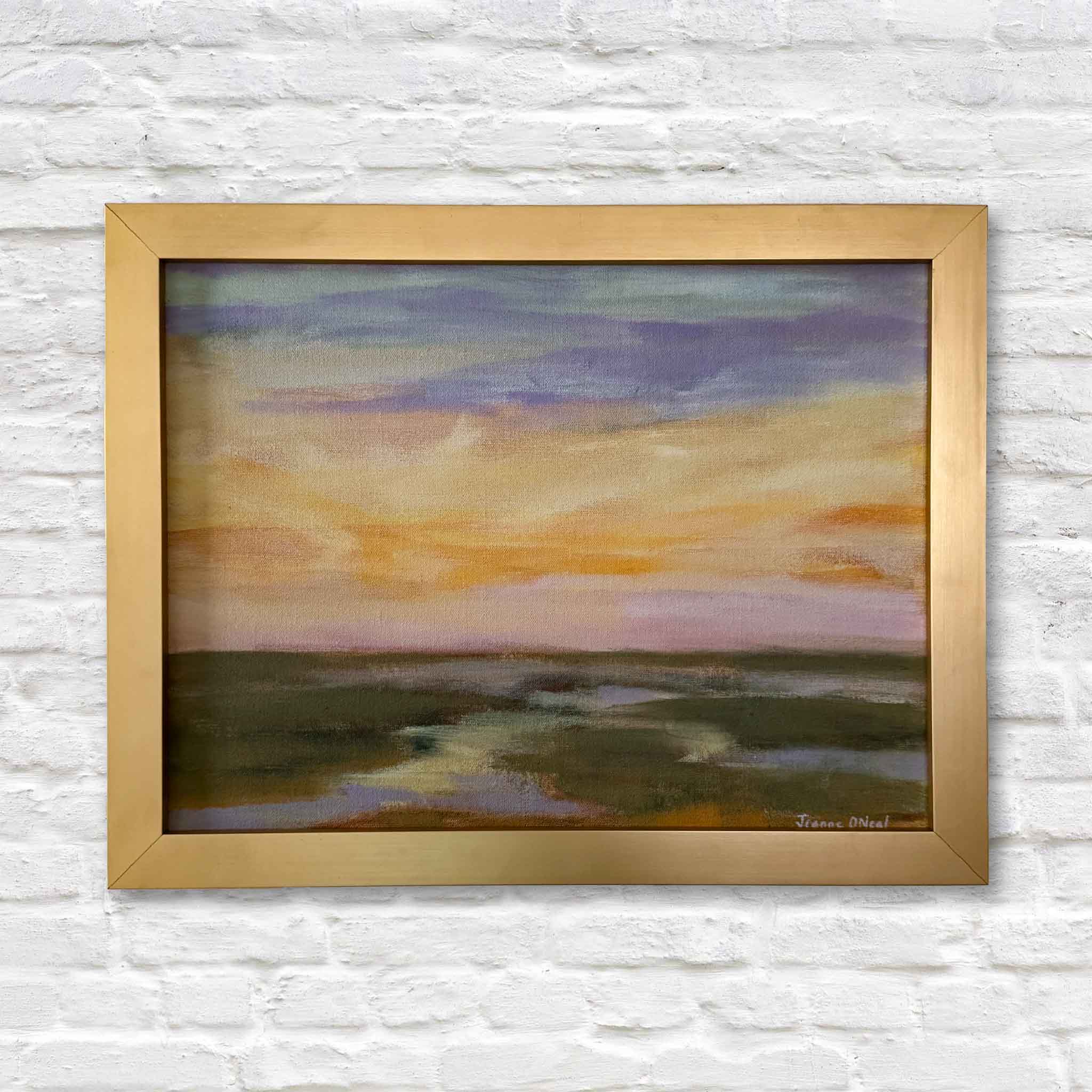 Framed original oil painting “2 A.M.” by local artist Jeanne O’Neal showing soft layered sunset colors over South Carolina Lowcountry marshland in warm gold frame at Gray Man Gallery in Pawleys Island