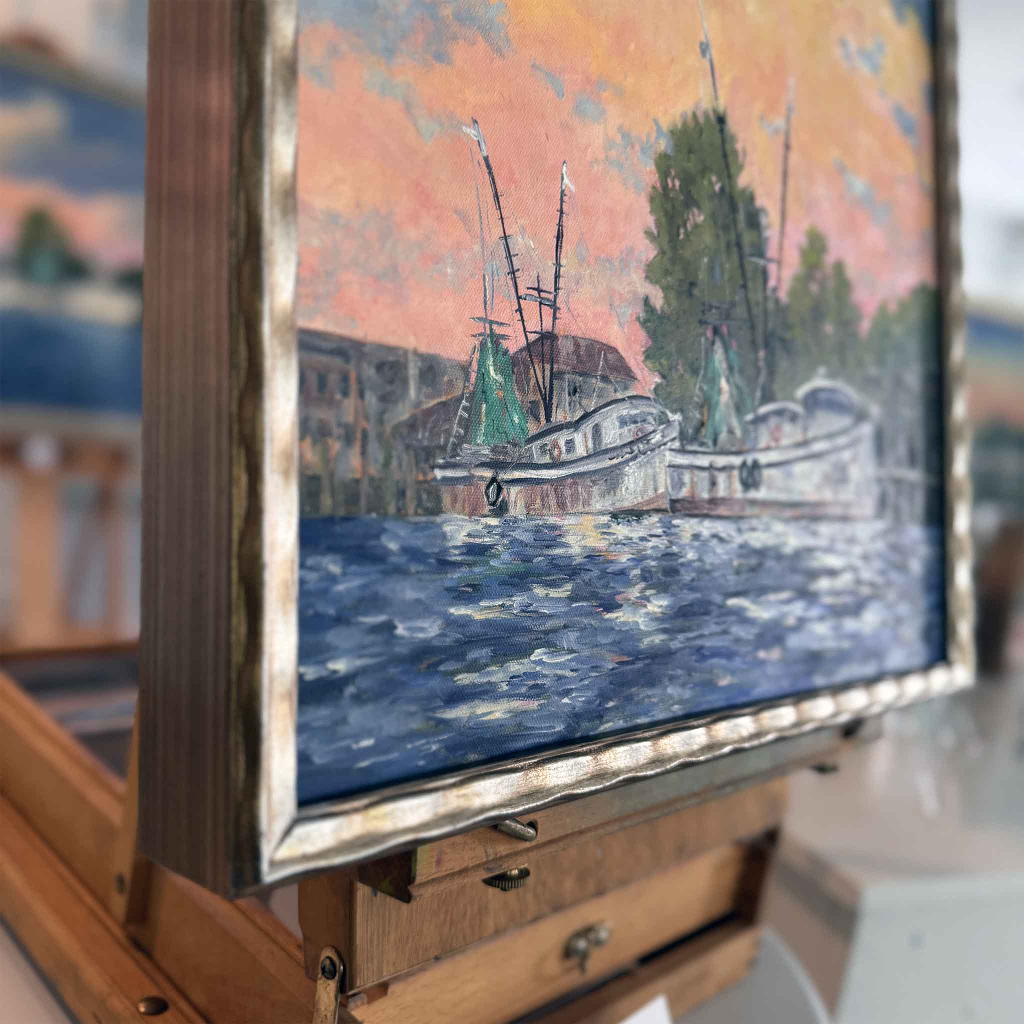 Framed original painting ‘Dockside Light’ by Jeanne O’Neal showing shrimp boats docked at sunset along the Georgetown, SC waterfront.