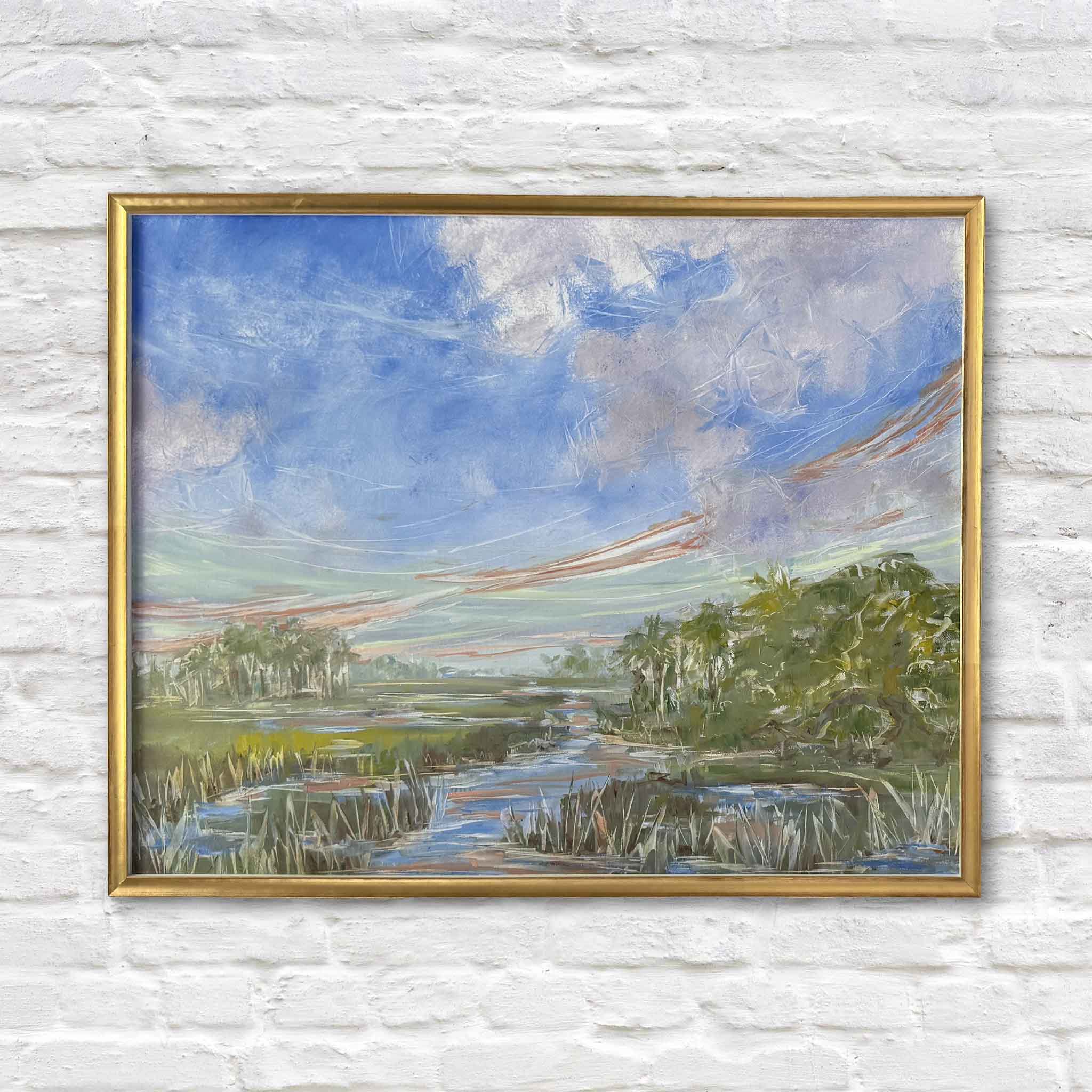 Morning Promise by Lowcountry artist Jeanne O'Neal is an original oil painting featuring a winding South Carolina marsh creek beneath expansive blue skies with soft coral cloud streaks. Framed in Jeanne's signature gold frame, this expressive coastal landscape is available at Gray Man Gallery in Pawleys Island and showcases her contemporary painterly interpretation of the Lowcountry.