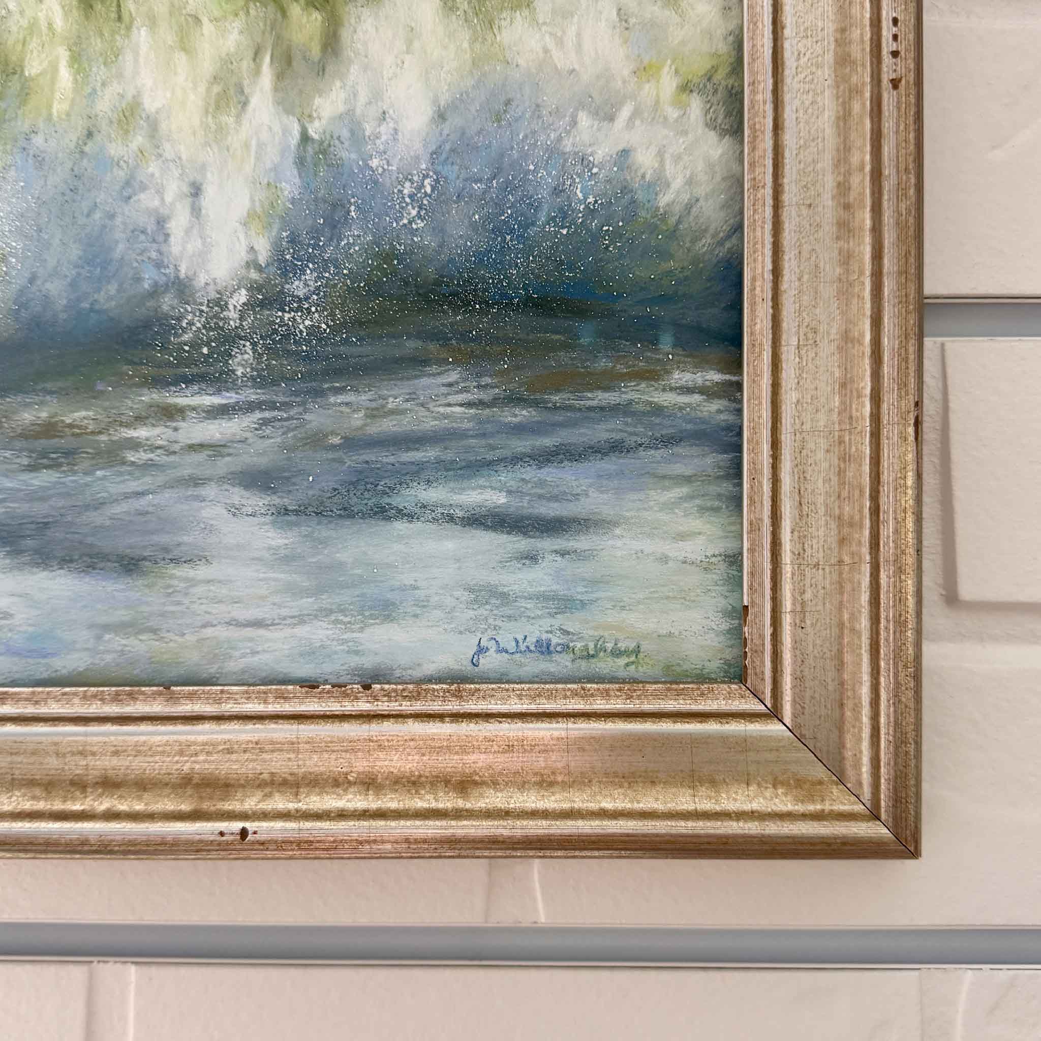 Close-up of Joanne Willoughby’s pastel wave painting showing detailed spray, water texture, and signature in the lower corner.