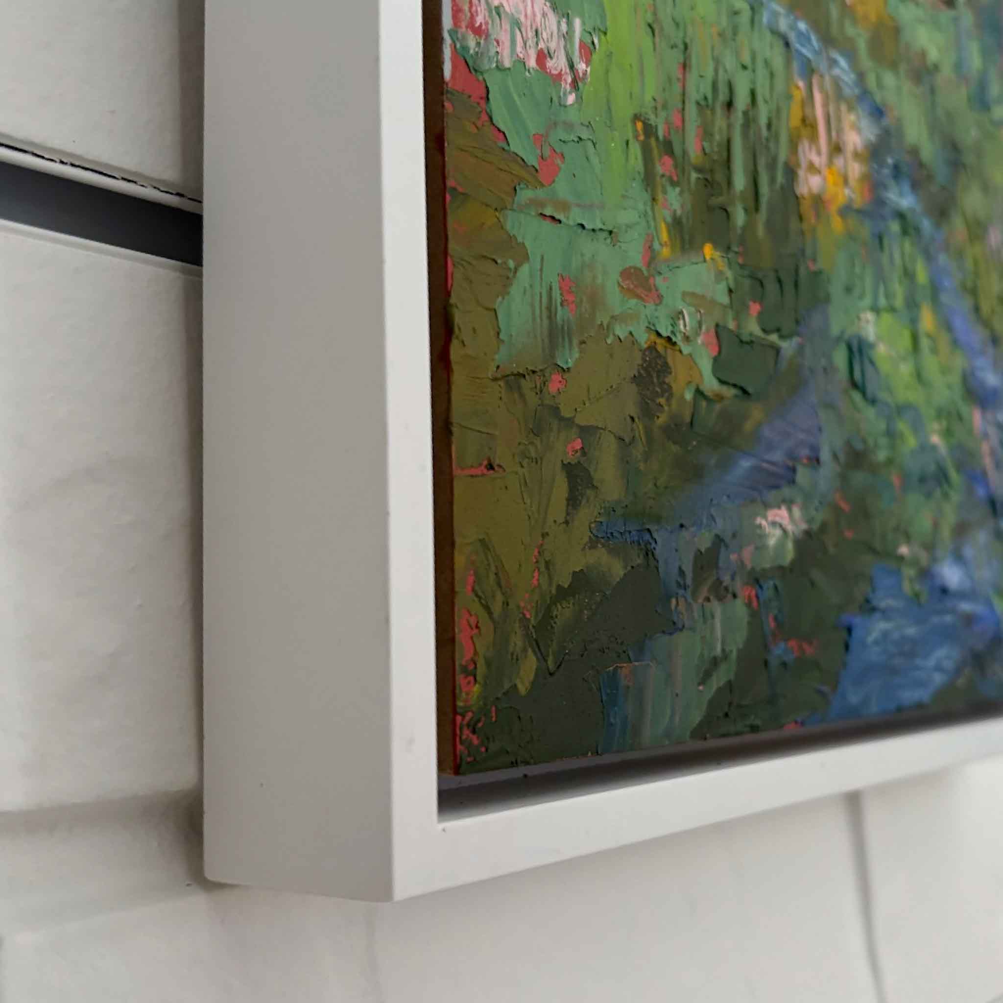 Close-up detail of Wild Marsh by Joanne Willoughby showing thick impasto brushwork, layered color, and the custom frame surrounding this original Lowcountry marsh oil painting at Gray Man Gallery.