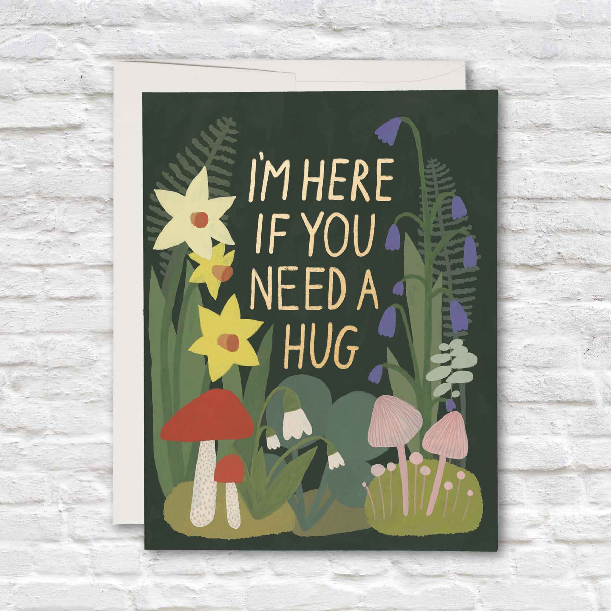 Garden Hugs support and sympathy greeting card illustrated by Kate Pugsley for Red Cap Cards featuring gold foil lettering, woodland flowers, mushrooms, and botanical illustrations. Shop this premium blank-inside encouragement card at Gray Man Gallery in Pawleys Island, South Carolina.