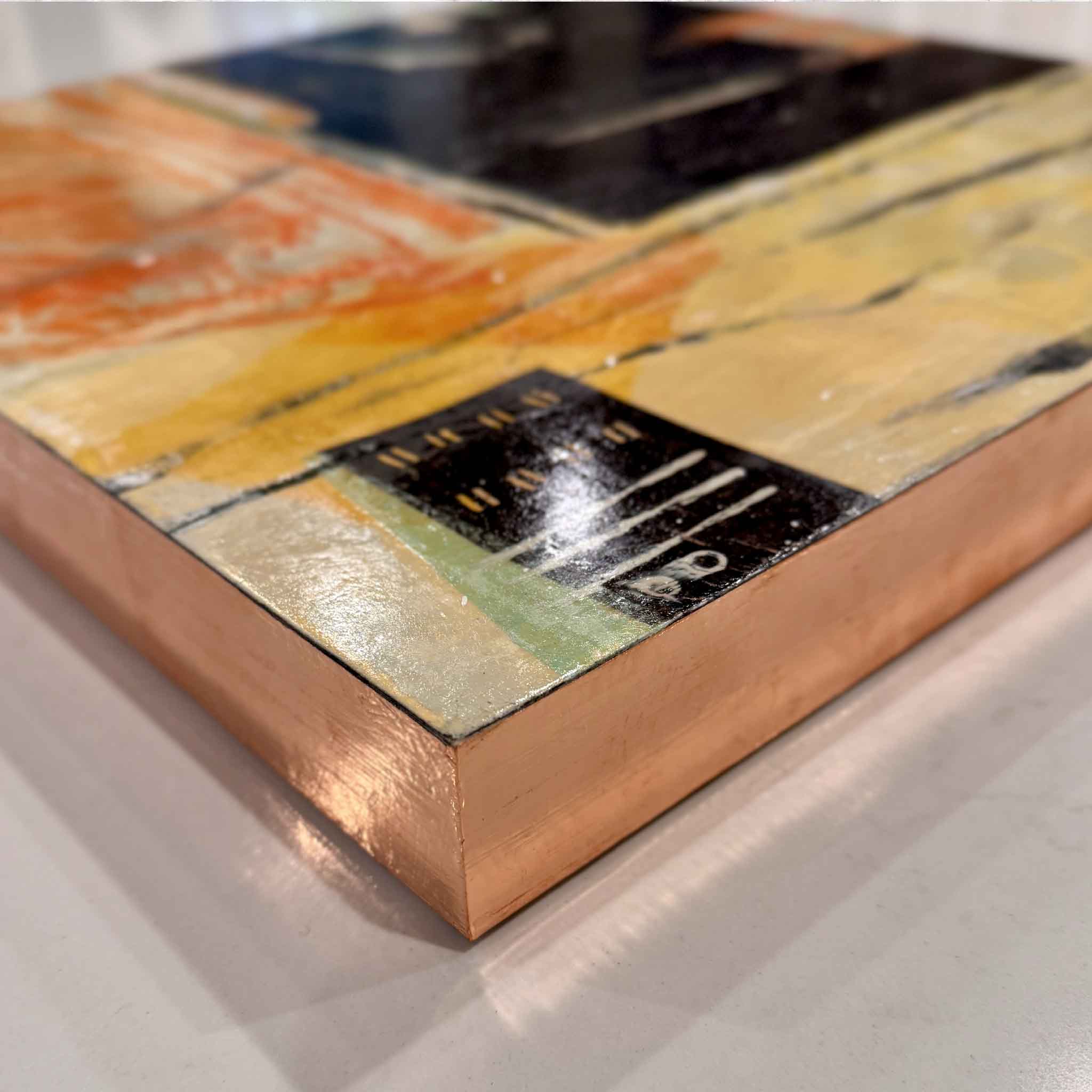 Close-up of the rose-gold leafed edges on Laurie McIntosh’s mixed-media piece “Feathered,” showing the textured surface and layered materials.