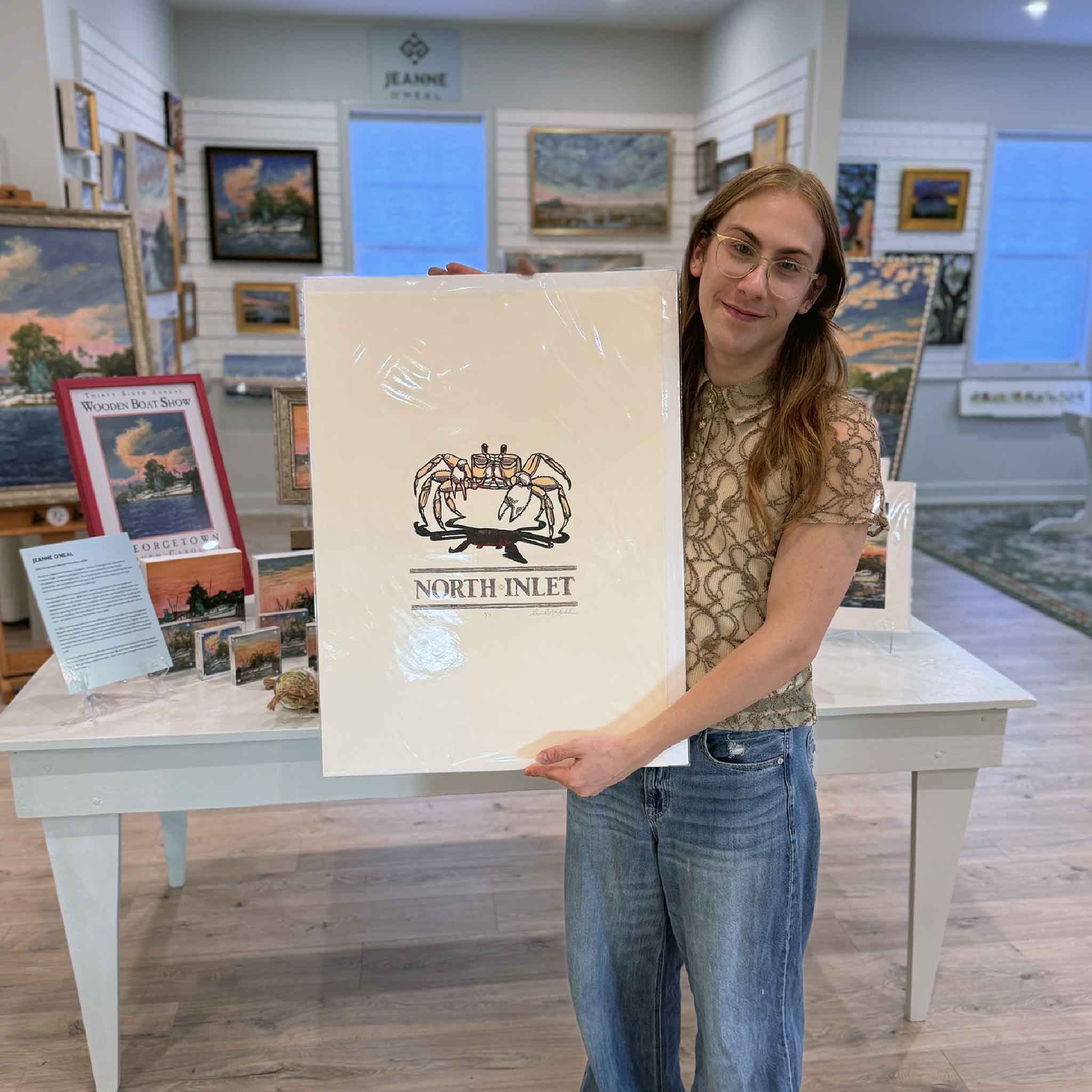 “North Inlet: Ghost Crab” original linocut by Laurie McIntosh held at Gray Man Gallery, featuring a hand-carved coastal ghost crab design.