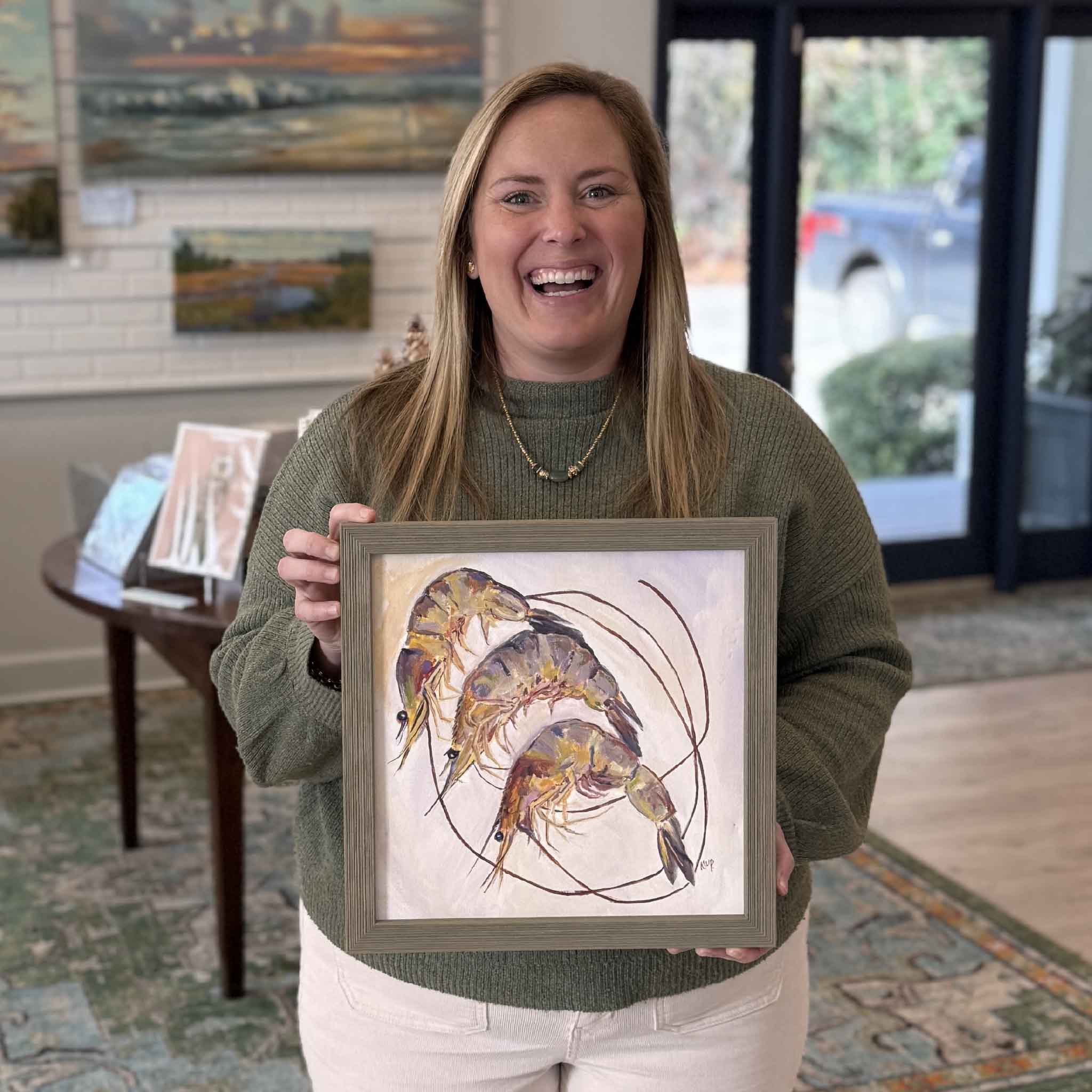 Lowcountry Catch by local artist Katherine W. Patrick, original oil painting shown framed and held inside Gray Man Gallery in Pawleys Island, SC, photographed for scale