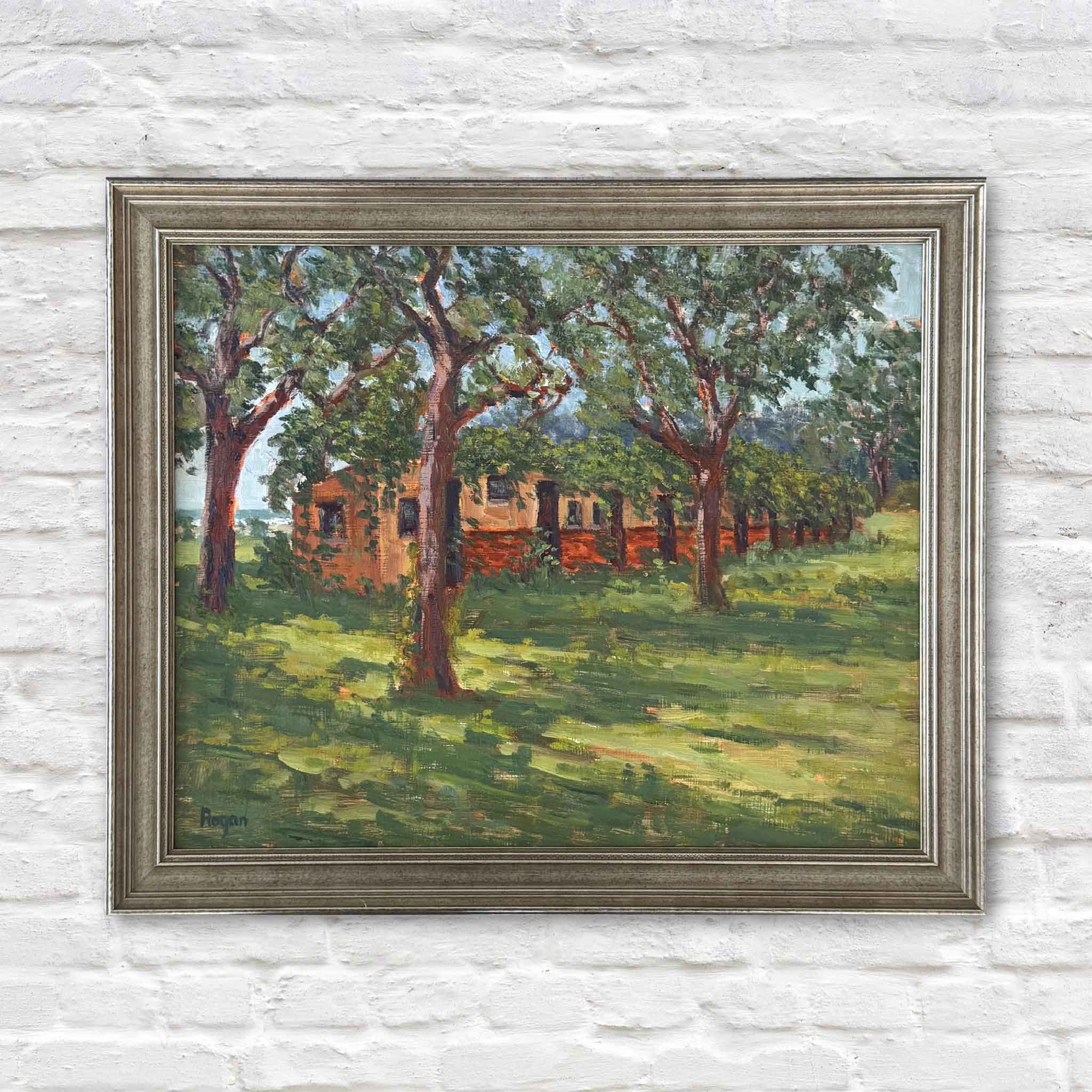 McKenzie Beach Oaks, an original oil painting by local artist Michael Rogan, depicting sunlit oak trees and a historic brick building at McKenzie Beach, professionally framed and available at Gray Man Gallery in Pawleys Island, South Carolina
