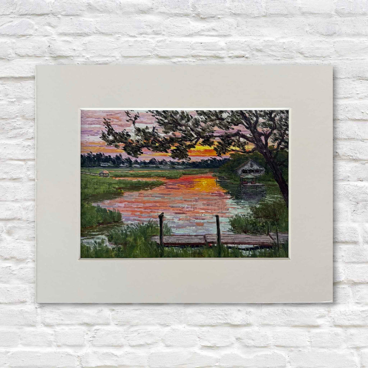 Fading Light fine art giclée print by Lowcountry artist Michael Rogan, depicting a colorful sunset reflected across the marsh in South Litchfield, South Carolina, professionally matted and available at Gray Man Gallery in Pawleys Island.
